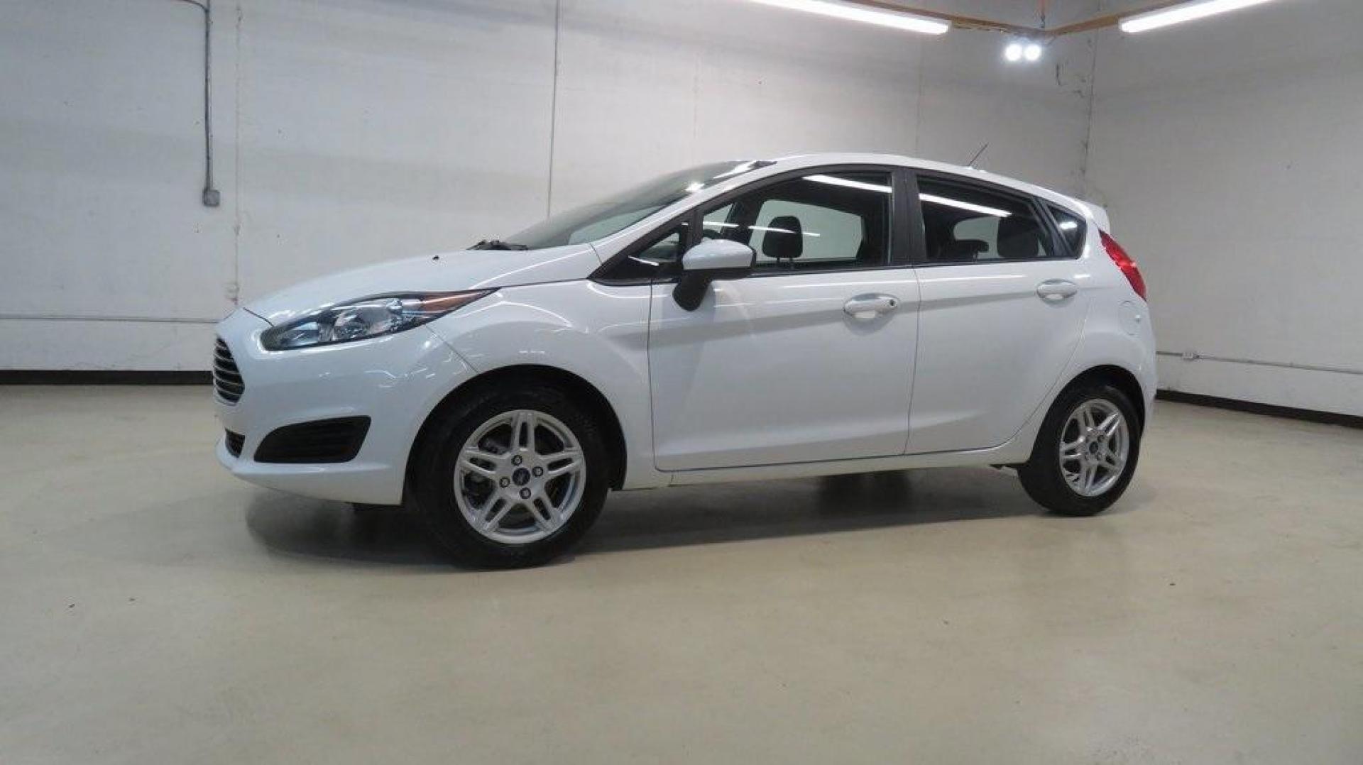 2018 Oxford White /Medium Light Stone Ford Fiesta SE (3FADP4EJ6JM) with an 1.6L I4 Ti-VCT engine, Automatic transmission, located at 15300 Midway Rd., Addison, TX, 75001, (972) 702-0011, 32.958321, -96.838074 - 2018 Ford Fiesta SE Hatchback<br>Now Available at Midway Auto Group Addison, Texas<br><br>Compact, stylish, and packed with value, the 2018 Ford Fiesta SE Hatchback is a fun-to-drive car that offers smart tech, impressive fuel economy, and hatchback versatility. Whether you're commuting through Add - Photo#4