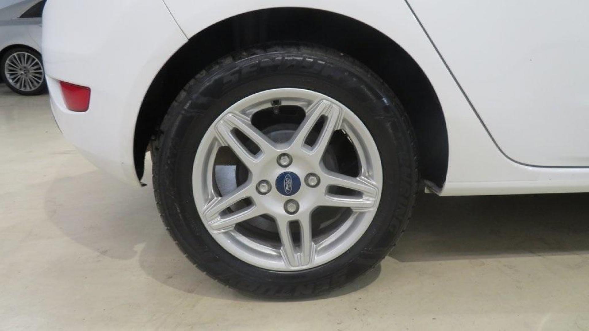 2018 Oxford White /Medium Light Stone Ford Fiesta SE (3FADP4EJ6JM) with an 1.6L I4 Ti-VCT engine, Automatic transmission, located at 15300 Midway Rd., Addison, TX, 75001, (972) 702-0011, 32.958321, -96.838074 - 2018 Ford Fiesta SE Hatchback<br>Now Available at Midway Auto Group Addison, Texas<br><br>Compact, stylish, and packed with value, the 2018 Ford Fiesta SE Hatchback is a fun-to-drive car that offers smart tech, impressive fuel economy, and hatchback versatility. Whether you're commuting through Add - Photo#10