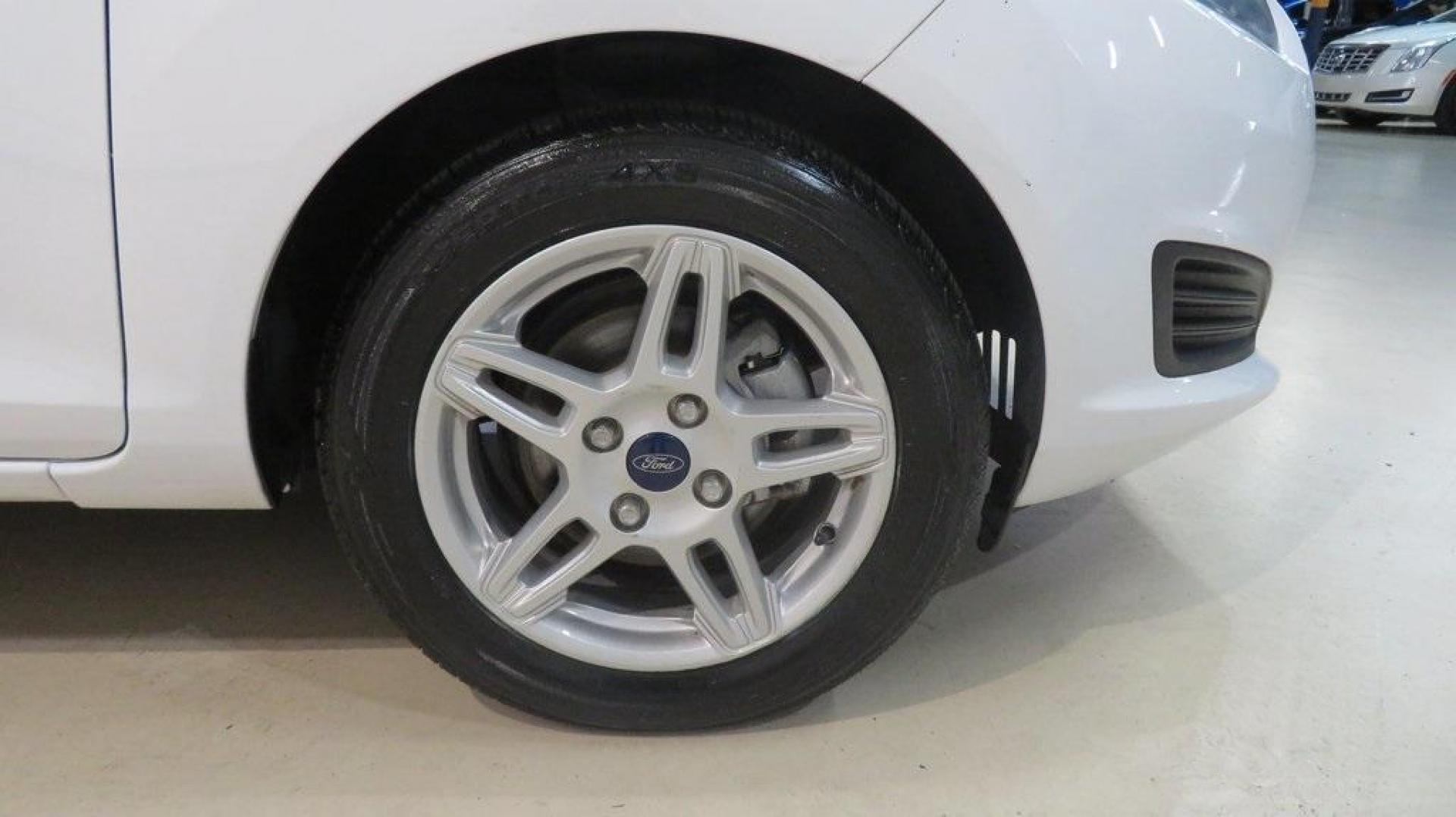 2018 Oxford White /Medium Light Stone Ford Fiesta SE (3FADP4EJ6JM) with an 1.6L I4 Ti-VCT engine, Automatic transmission, located at 15300 Midway Rd., Addison, TX, 75001, (972) 702-0011, 32.958321, -96.838074 - 2018 Ford Fiesta SE Hatchback<br>Now Available at Midway Auto Group Addison, Texas<br><br>Compact, stylish, and packed with value, the 2018 Ford Fiesta SE Hatchback is a fun-to-drive car that offers smart tech, impressive fuel economy, and hatchback versatility. Whether you're commuting through Add - Photo#11