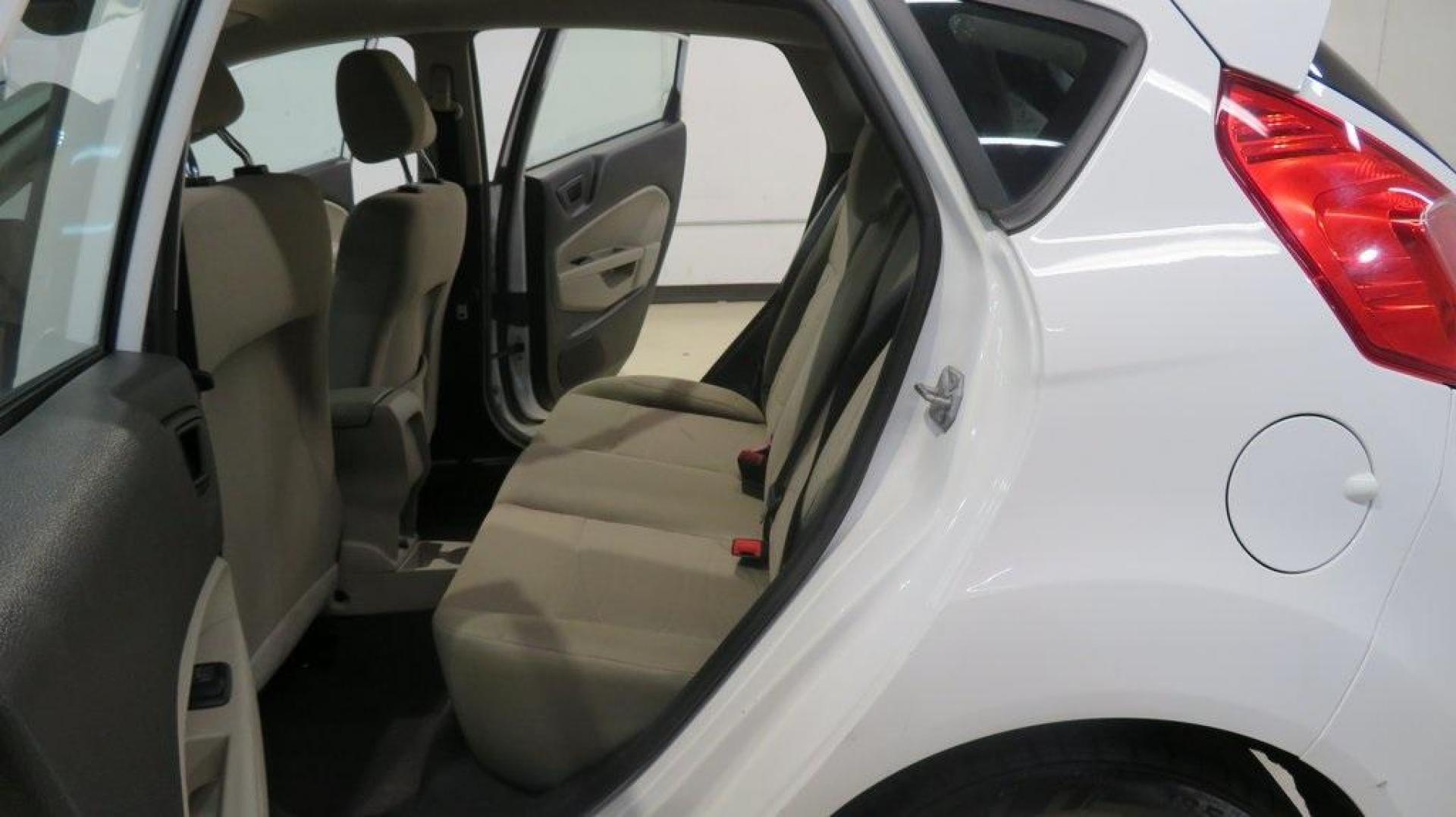 2018 Oxford White /Medium Light Stone Ford Fiesta SE (3FADP4EJ6JM) with an 1.6L I4 Ti-VCT engine, Automatic transmission, located at 15300 Midway Rd., Addison, TX, 75001, (972) 702-0011, 32.958321, -96.838074 - 2018 Ford Fiesta SE Hatchback<br>Now Available at Midway Auto Group Addison, Texas<br><br>Compact, stylish, and packed with value, the 2018 Ford Fiesta SE Hatchback is a fun-to-drive car that offers smart tech, impressive fuel economy, and hatchback versatility. Whether you're commuting through Add - Photo#15