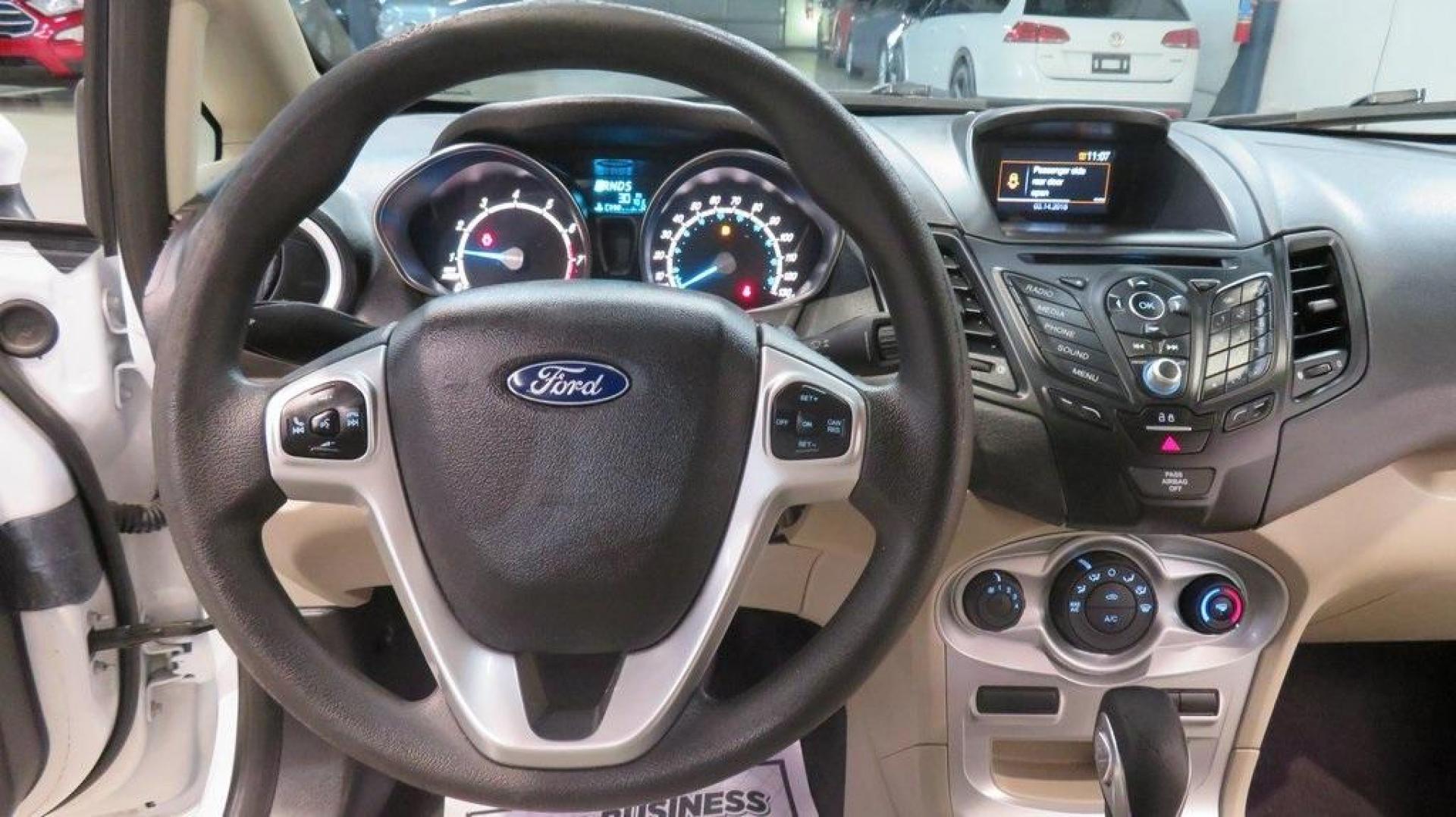 2018 Oxford White /Medium Light Stone Ford Fiesta SE (3FADP4EJ6JM) with an 1.6L I4 Ti-VCT engine, Automatic transmission, located at 15300 Midway Rd., Addison, TX, 75001, (972) 702-0011, 32.958321, -96.838074 - 2018 Ford Fiesta SE Hatchback<br>Now Available at Midway Auto Group Addison, Texas<br><br>Compact, stylish, and packed with value, the 2018 Ford Fiesta SE Hatchback is a fun-to-drive car that offers smart tech, impressive fuel economy, and hatchback versatility. Whether you're commuting through Add - Photo#16