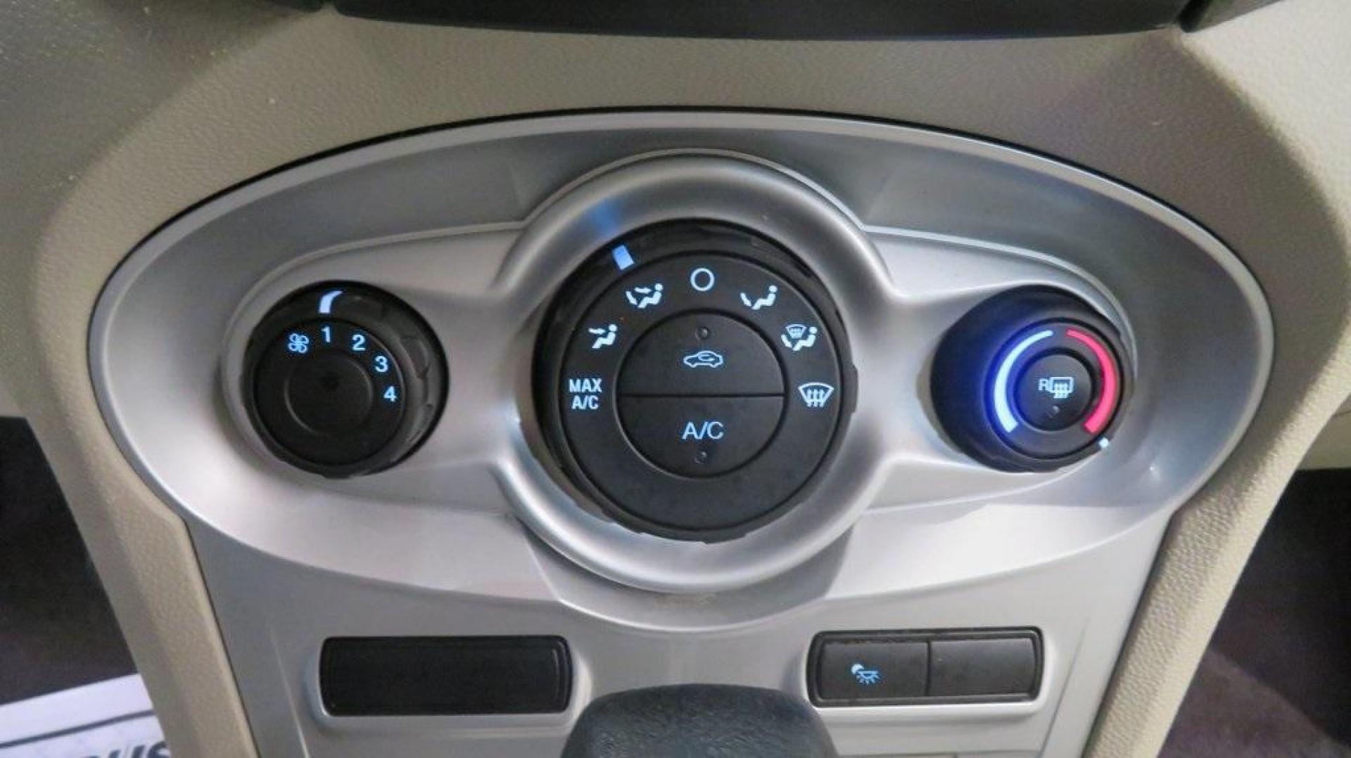 2018 Oxford White /Medium Light Stone Ford Fiesta SE (3FADP4EJ6JM) with an 1.6L I4 Ti-VCT engine, Automatic transmission, located at 15300 Midway Rd., Addison, TX, 75001, (972) 702-0011, 32.958321, -96.838074 - 2018 Ford Fiesta SE Hatchback<br>Now Available at Midway Auto Group Addison, Texas<br><br>Compact, stylish, and packed with value, the 2018 Ford Fiesta SE Hatchback is a fun-to-drive car that offers smart tech, impressive fuel economy, and hatchback versatility. Whether you're commuting through Add - Photo#20