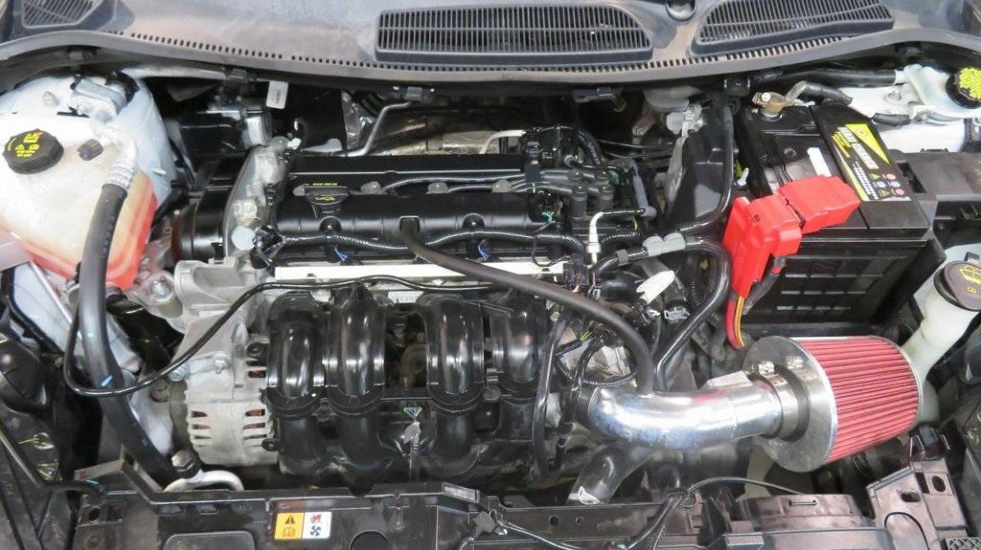 2018 Oxford White /Medium Light Stone Ford Fiesta SE (3FADP4EJ6JM) with an 1.6L I4 Ti-VCT engine, Automatic transmission, located at 15300 Midway Rd., Addison, TX, 75001, (972) 702-0011, 32.958321, -96.838074 - 2018 Ford Fiesta SE Hatchback<br>Now Available at Midway Auto Group Addison, Texas<br><br>Compact, stylish, and packed with value, the 2018 Ford Fiesta SE Hatchback is a fun-to-drive car that offers smart tech, impressive fuel economy, and hatchback versatility. Whether you're commuting through Add - Photo#26