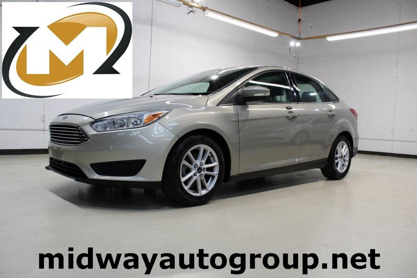 2015 Tectonic /Medium Light Stone Ford Focus SE (1FADP3F29FL) with an 2.0L 4-Cylinder DGI Flex Fuel DOHC engine, Automatic transmission, located at 15300 Midway Rd., Addison, TX, 75001, (972) 702-0011, 32.958321, -96.838074 - 2015 Ford Focus SE<br>Now Available at Midway Auto Group Addison, Texas<br><br>Efficient, comfortable, and packed with useful tech, the 2015 Ford Focus SE is the ideal compact sedan for daily driving around Addison or longer commutes across Texas. With a sleek design and responsive handling, it off - Photo#0