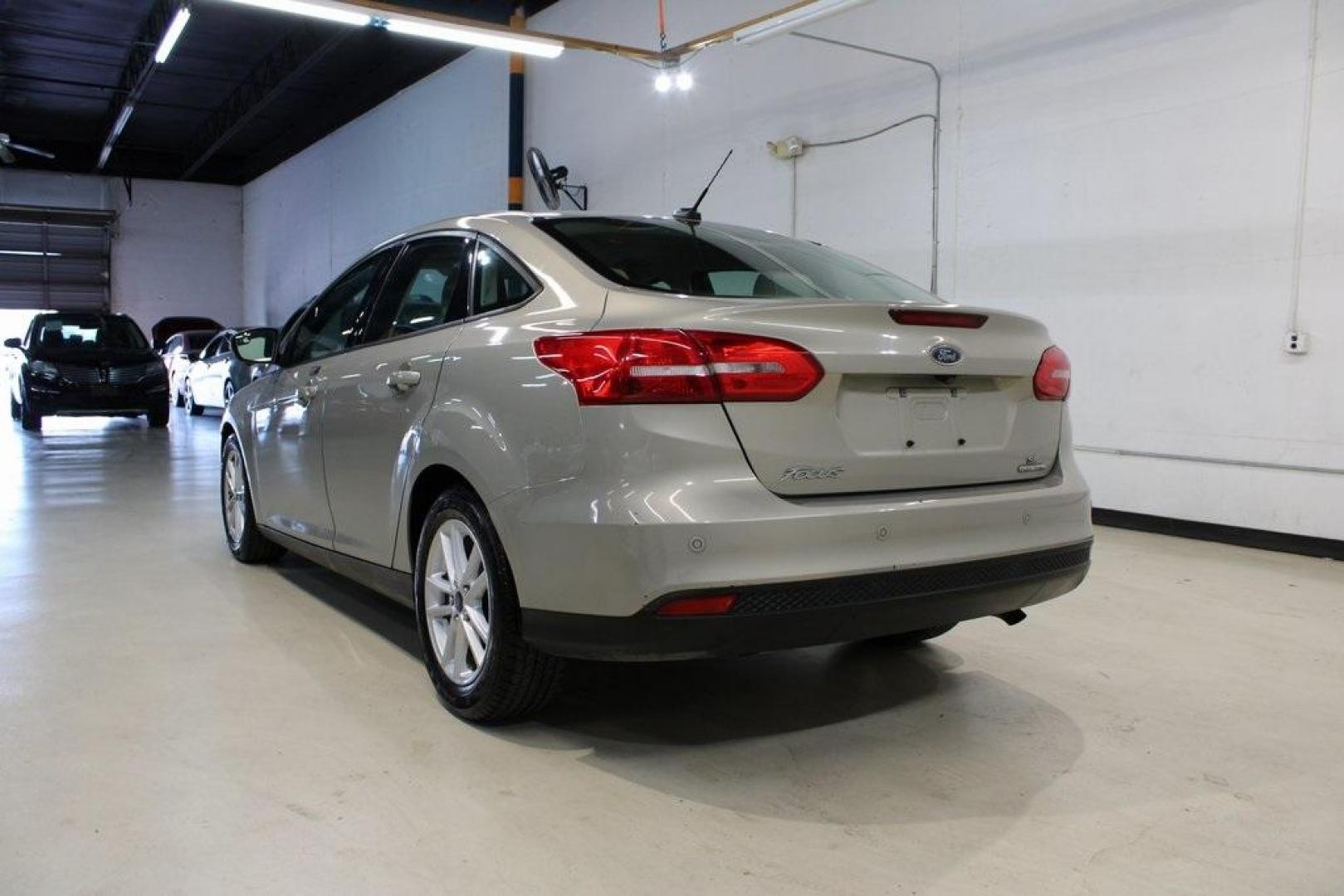 2015 Tectonic /Medium Light Stone Ford Focus SE (1FADP3F29FL) with an 2.0L 4-Cylinder DGI Flex Fuel DOHC engine, Automatic transmission, located at 15300 Midway Rd., Addison, TX, 75001, (972) 702-0011, 32.958321, -96.838074 - 2015 Ford Focus SE<br>Now Available at Midway Auto Group Addison, Texas<br><br>Efficient, comfortable, and packed with useful tech, the 2015 Ford Focus SE is the ideal compact sedan for daily driving around Addison or longer commutes across Texas. With a sleek design and responsive handling, it off - Photo#3