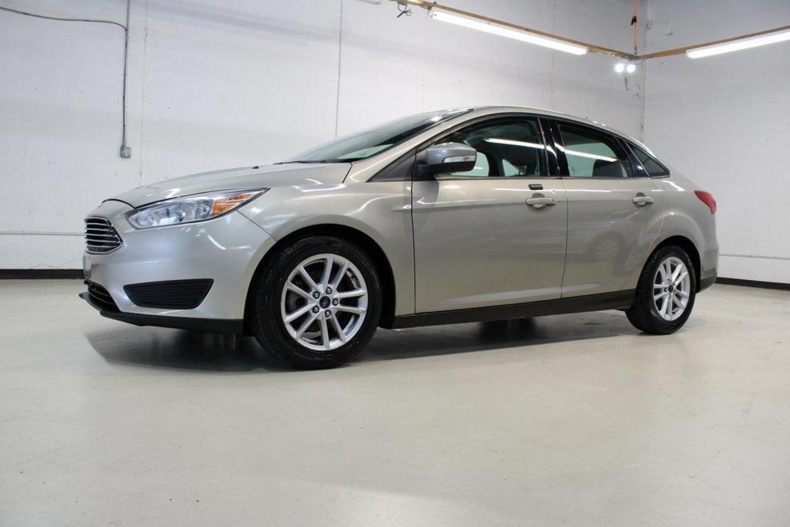 2015 Tectonic /Medium Light Stone Ford Focus SE (1FADP3F29FL) with an 2.0L 4-Cylinder DGI Flex Fuel DOHC engine, Automatic transmission, located at 15300 Midway Rd., Addison, TX, 75001, (972) 702-0011, 32.958321, -96.838074 - 2015 Ford Focus SE<br>Now Available at Midway Auto Group Addison, Texas<br><br>Efficient, comfortable, and packed with useful tech, the 2015 Ford Focus SE is the ideal compact sedan for daily driving around Addison or longer commutes across Texas. With a sleek design and responsive handling, it off - Photo#4