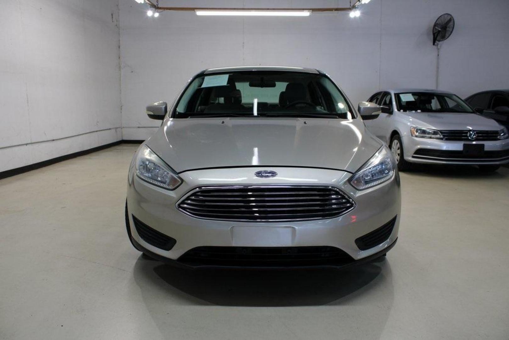 2015 Tectonic /Medium Light Stone Ford Focus SE (1FADP3F29FL) with an 2.0L 4-Cylinder DGI Flex Fuel DOHC engine, Automatic transmission, located at 15300 Midway Rd., Addison, TX, 75001, (972) 702-0011, 32.958321, -96.838074 - 2015 Ford Focus SE<br>Now Available at Midway Auto Group Addison, Texas<br><br>Efficient, comfortable, and packed with useful tech, the 2015 Ford Focus SE is the ideal compact sedan for daily driving around Addison or longer commutes across Texas. With a sleek design and responsive handling, it off - Photo#5