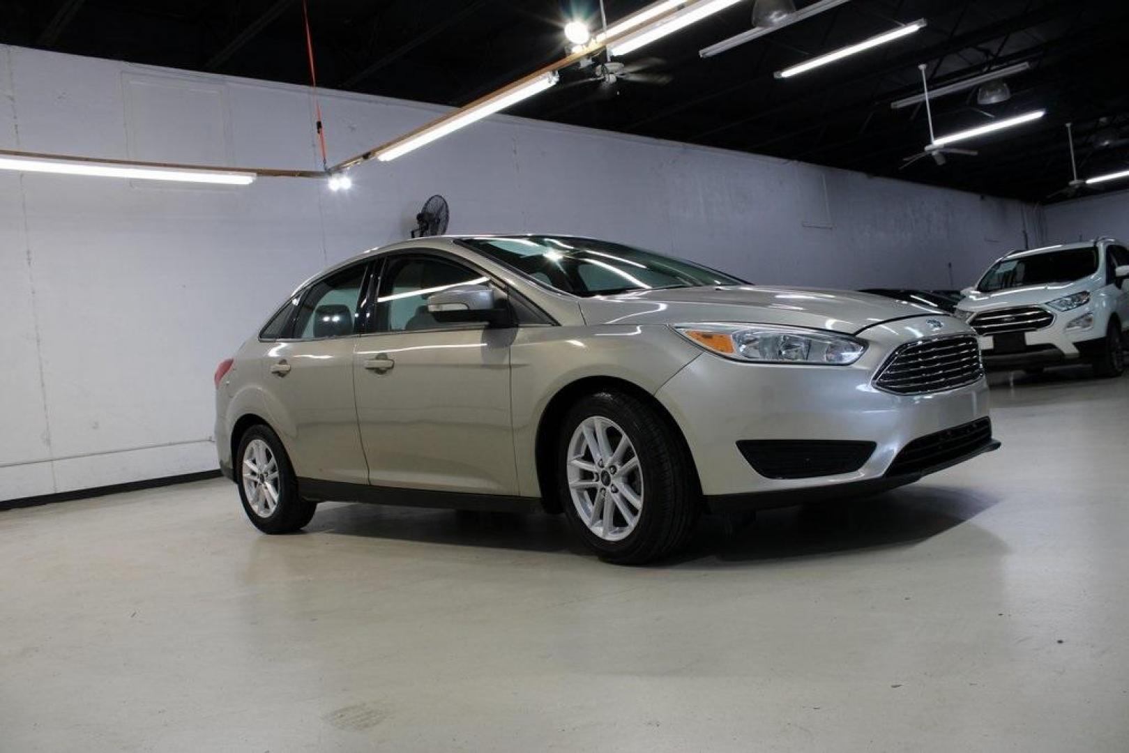 2015 Tectonic /Medium Light Stone Ford Focus SE (1FADP3F29FL) with an 2.0L 4-Cylinder DGI Flex Fuel DOHC engine, Automatic transmission, located at 15300 Midway Rd., Addison, TX, 75001, (972) 702-0011, 32.958321, -96.838074 - 2015 Ford Focus SE<br>Now Available at Midway Auto Group Addison, Texas<br><br>Efficient, comfortable, and packed with useful tech, the 2015 Ford Focus SE is the ideal compact sedan for daily driving around Addison or longer commutes across Texas. With a sleek design and responsive handling, it off - Photo#6