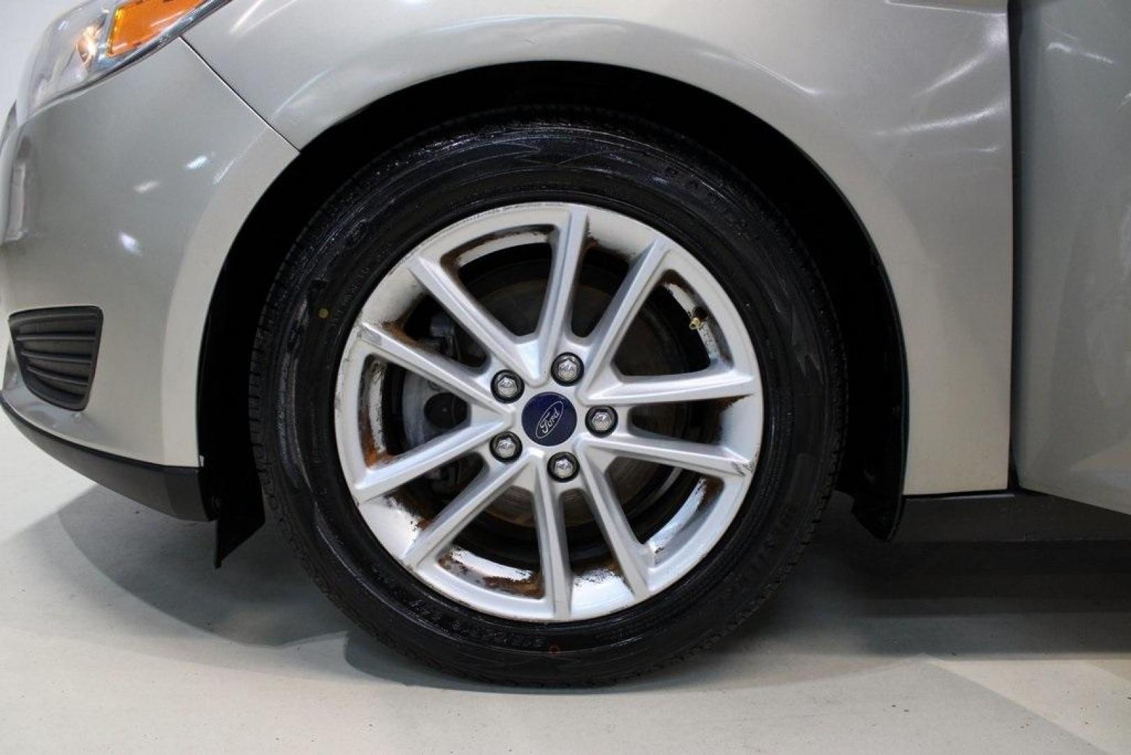 2015 Tectonic /Medium Light Stone Ford Focus SE (1FADP3F29FL) with an 2.0L 4-Cylinder DGI Flex Fuel DOHC engine, Automatic transmission, located at 15300 Midway Rd., Addison, TX, 75001, (972) 702-0011, 32.958321, -96.838074 - 2015 Ford Focus SE<br>Now Available at Midway Auto Group Addison, Texas<br><br>Efficient, comfortable, and packed with useful tech, the 2015 Ford Focus SE is the ideal compact sedan for daily driving around Addison or longer commutes across Texas. With a sleek design and responsive handling, it off - Photo#8