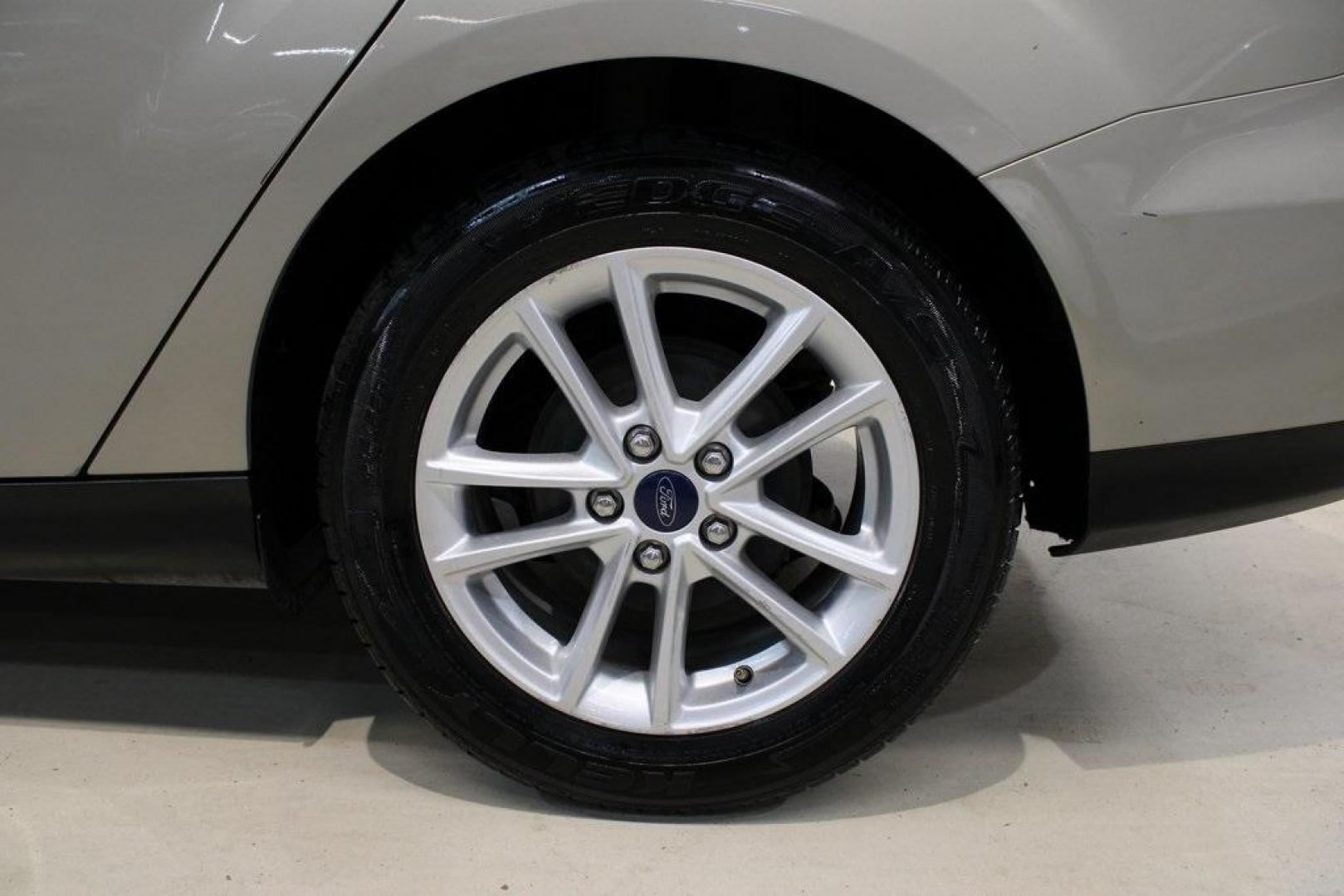 2015 Tectonic /Medium Light Stone Ford Focus SE (1FADP3F29FL) with an 2.0L 4-Cylinder DGI Flex Fuel DOHC engine, Automatic transmission, located at 15300 Midway Rd., Addison, TX, 75001, (972) 702-0011, 32.958321, -96.838074 - 2015 Ford Focus SE<br>Now Available at Midway Auto Group Addison, Texas<br><br>Efficient, comfortable, and packed with useful tech, the 2015 Ford Focus SE is the ideal compact sedan for daily driving around Addison or longer commutes across Texas. With a sleek design and responsive handling, it off - Photo#9