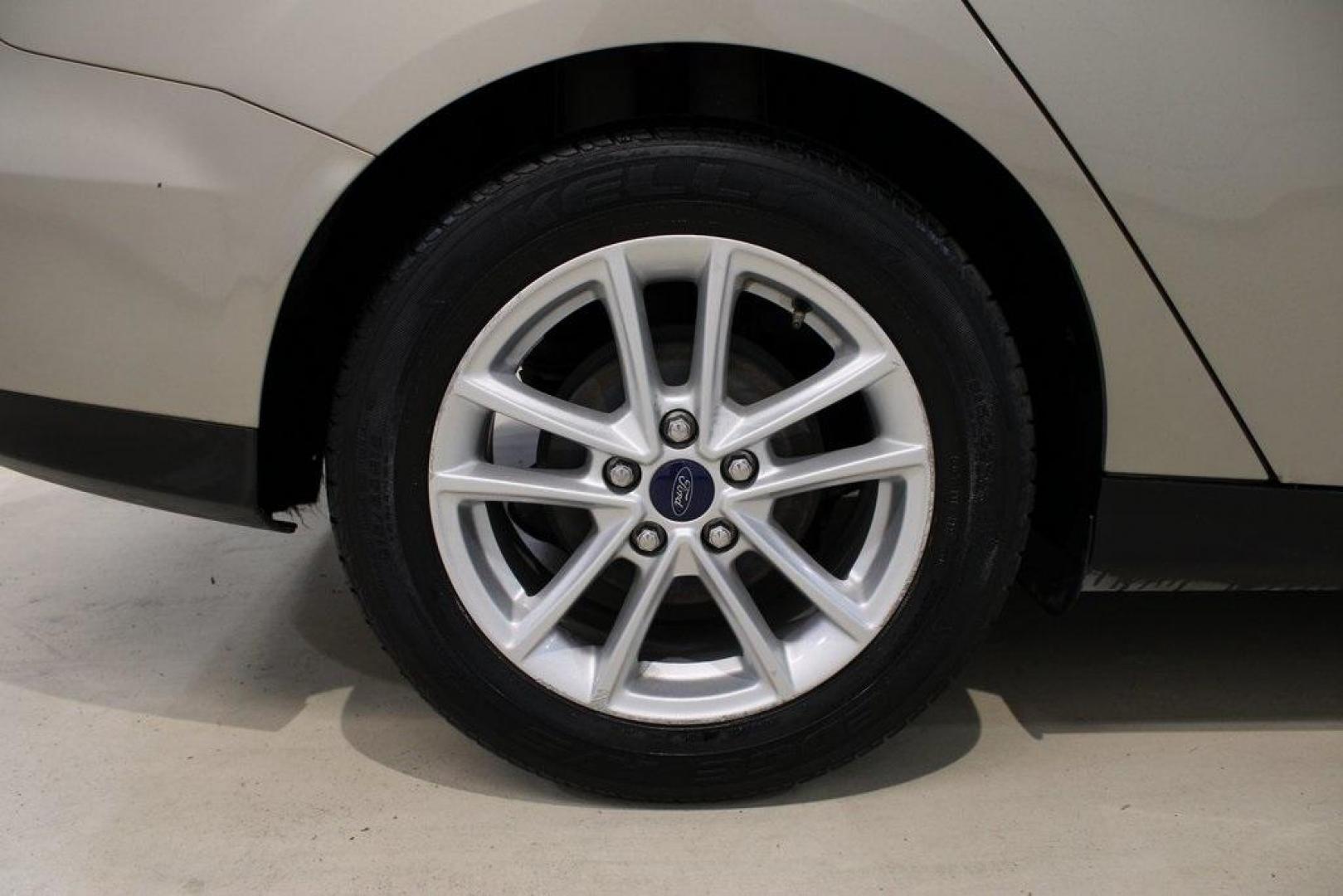 2015 Tectonic /Medium Light Stone Ford Focus SE (1FADP3F29FL) with an 2.0L 4-Cylinder DGI Flex Fuel DOHC engine, Automatic transmission, located at 15300 Midway Rd., Addison, TX, 75001, (972) 702-0011, 32.958321, -96.838074 - 2015 Ford Focus SE<br>Now Available at Midway Auto Group Addison, Texas<br><br>Efficient, comfortable, and packed with useful tech, the 2015 Ford Focus SE is the ideal compact sedan for daily driving around Addison or longer commutes across Texas. With a sleek design and responsive handling, it off - Photo#10