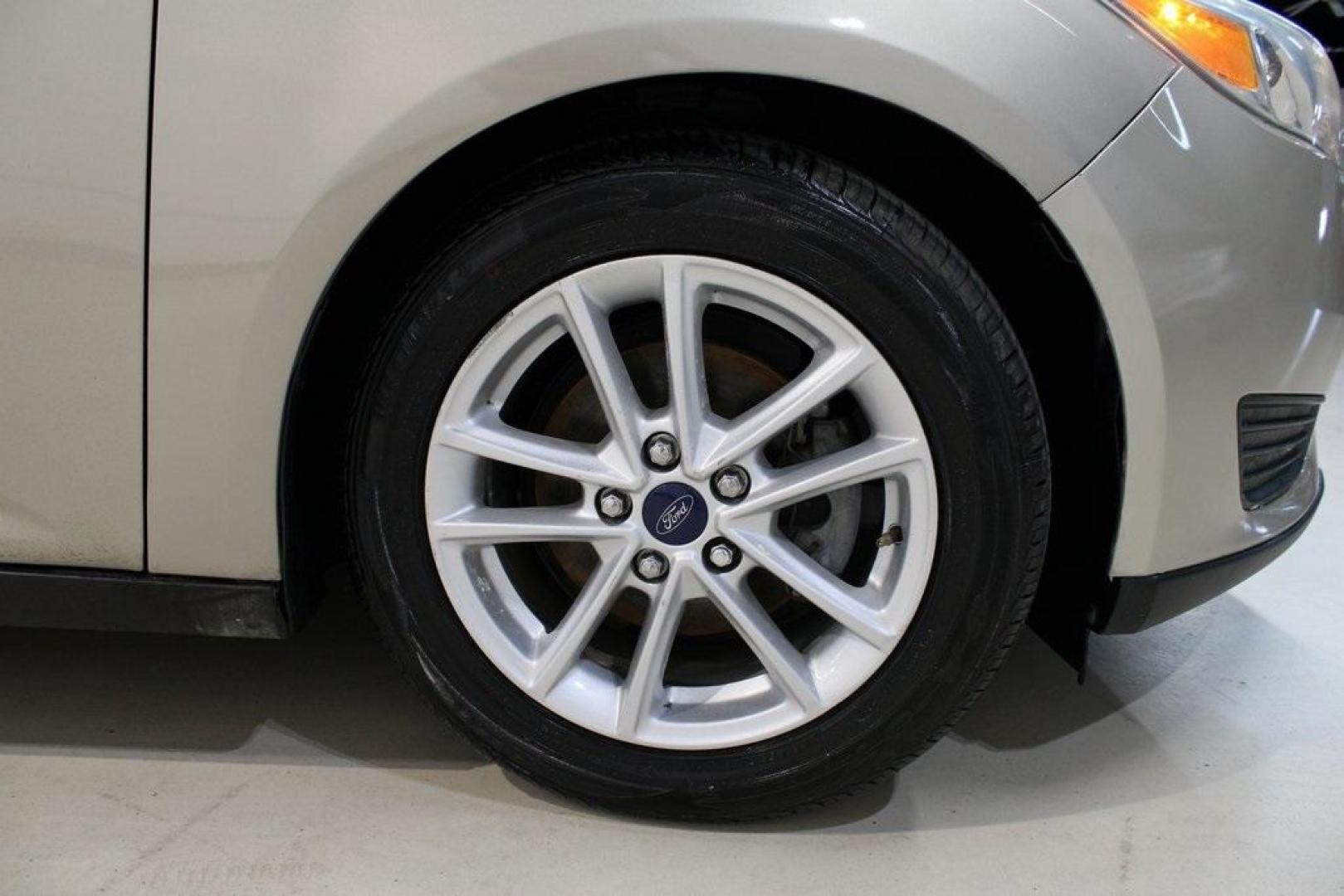 2015 Tectonic /Medium Light Stone Ford Focus SE (1FADP3F29FL) with an 2.0L 4-Cylinder DGI Flex Fuel DOHC engine, Automatic transmission, located at 15300 Midway Rd., Addison, TX, 75001, (972) 702-0011, 32.958321, -96.838074 - 2015 Ford Focus SE<br>Now Available at Midway Auto Group Addison, Texas<br><br>Efficient, comfortable, and packed with useful tech, the 2015 Ford Focus SE is the ideal compact sedan for daily driving around Addison or longer commutes across Texas. With a sleek design and responsive handling, it off - Photo#11