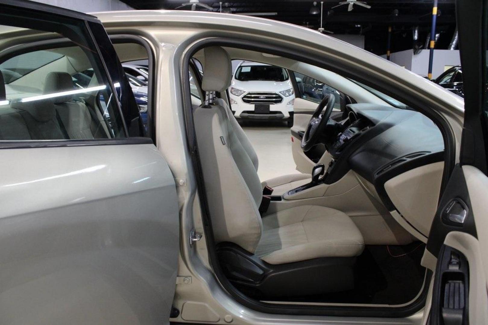 2015 Tectonic /Medium Light Stone Ford Focus SE (1FADP3F29FL) with an 2.0L 4-Cylinder DGI Flex Fuel DOHC engine, Automatic transmission, located at 15300 Midway Rd., Addison, TX, 75001, (972) 702-0011, 32.958321, -96.838074 - 2015 Ford Focus SE<br>Now Available at Midway Auto Group Addison, Texas<br><br>Efficient, comfortable, and packed with useful tech, the 2015 Ford Focus SE is the ideal compact sedan for daily driving around Addison or longer commutes across Texas. With a sleek design and responsive handling, it off - Photo#14