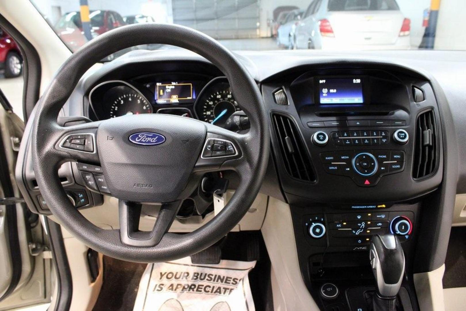 2015 Tectonic /Medium Light Stone Ford Focus SE (1FADP3F29FL) with an 2.0L 4-Cylinder DGI Flex Fuel DOHC engine, Automatic transmission, located at 15300 Midway Rd., Addison, TX, 75001, (972) 702-0011, 32.958321, -96.838074 - 2015 Ford Focus SE<br>Now Available at Midway Auto Group Addison, Texas<br><br>Efficient, comfortable, and packed with useful tech, the 2015 Ford Focus SE is the ideal compact sedan for daily driving around Addison or longer commutes across Texas. With a sleek design and responsive handling, it off - Photo#17