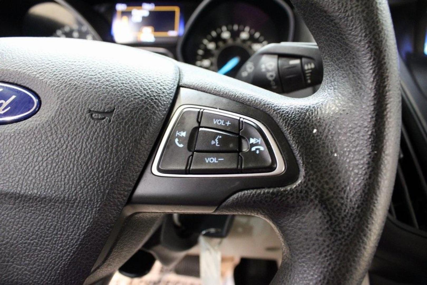 2015 Tectonic /Medium Light Stone Ford Focus SE (1FADP3F29FL) with an 2.0L 4-Cylinder DGI Flex Fuel DOHC engine, Automatic transmission, located at 15300 Midway Rd., Addison, TX, 75001, (972) 702-0011, 32.958321, -96.838074 - 2015 Ford Focus SE<br>Now Available at Midway Auto Group Addison, Texas<br><br>Efficient, comfortable, and packed with useful tech, the 2015 Ford Focus SE is the ideal compact sedan for daily driving around Addison or longer commutes across Texas. With a sleek design and responsive handling, it off - Photo#23