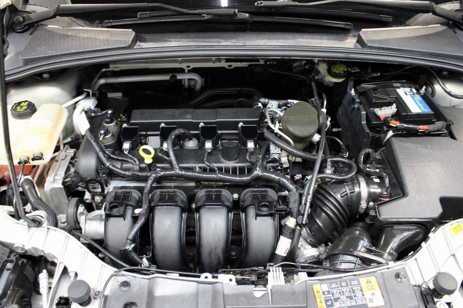 2015 Tectonic /Medium Light Stone Ford Focus SE (1FADP3F29FL) with an 2.0L 4-Cylinder DGI Flex Fuel DOHC engine, Automatic transmission, located at 15300 Midway Rd., Addison, TX, 75001, (972) 702-0011, 32.958321, -96.838074 - 2015 Ford Focus SE<br>Now Available at Midway Auto Group Addison, Texas<br><br>Efficient, comfortable, and packed with useful tech, the 2015 Ford Focus SE is the ideal compact sedan for daily driving around Addison or longer commutes across Texas. With a sleek design and responsive handling, it off - Photo#27