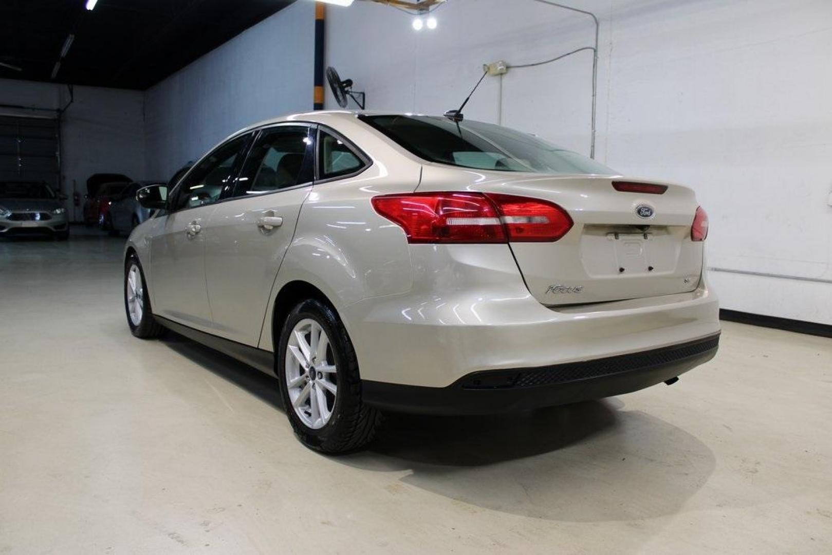 2017 White Gold /Medium Light Stone Ford Focus SE (1FADP3F20HL) with an 2.0L 4-Cylinder DGI Flex Fuel Turbocharged DOHC engine, Automatic transmission, located at 15300 Midway Rd., Addison, TX, 75001, (972) 702-0011, 32.958321, -96.838074 - 2017 Ford Focus SE<br>Now Available at Midway Auto Group Addison, Texas<br><br>Smart, efficient, and comfortable, the 2017 Ford Focus SE is a compact sedan that delivers excellent fuel economy, responsive handling, and modern tech at a budget-friendly price. Whether youre commuting through Addison - Photo#3