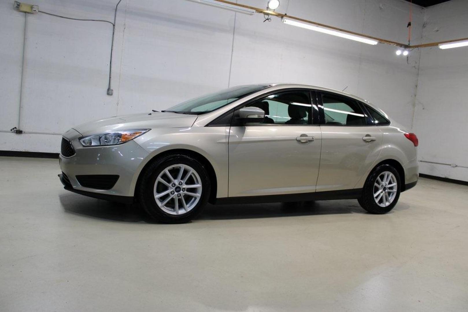 2017 White Gold /Medium Light Stone Ford Focus SE (1FADP3F20HL) with an 2.0L 4-Cylinder DGI Flex Fuel Turbocharged DOHC engine, Automatic transmission, located at 15300 Midway Rd., Addison, TX, 75001, (972) 702-0011, 32.958321, -96.838074 - 2017 Ford Focus SE<br>Now Available at Midway Auto Group Addison, Texas<br><br>Smart, efficient, and comfortable, the 2017 Ford Focus SE is a compact sedan that delivers excellent fuel economy, responsive handling, and modern tech at a budget-friendly price. Whether youre commuting through Addison - Photo#4