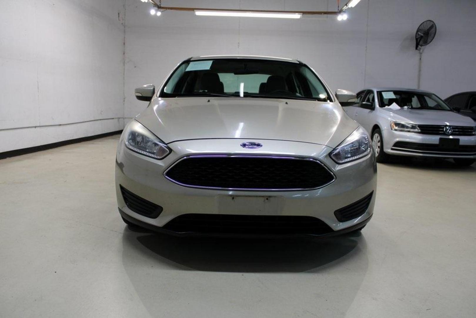 2017 White Gold /Medium Light Stone Ford Focus SE (1FADP3F20HL) with an 2.0L 4-Cylinder DGI Flex Fuel Turbocharged DOHC engine, Automatic transmission, located at 15300 Midway Rd., Addison, TX, 75001, (972) 702-0011, 32.958321, -96.838074 - 2017 Ford Focus SE<br>Now Available at Midway Auto Group Addison, Texas<br><br>Smart, efficient, and comfortable, the 2017 Ford Focus SE is a compact sedan that delivers excellent fuel economy, responsive handling, and modern tech at a budget-friendly price. Whether youre commuting through Addison - Photo#5