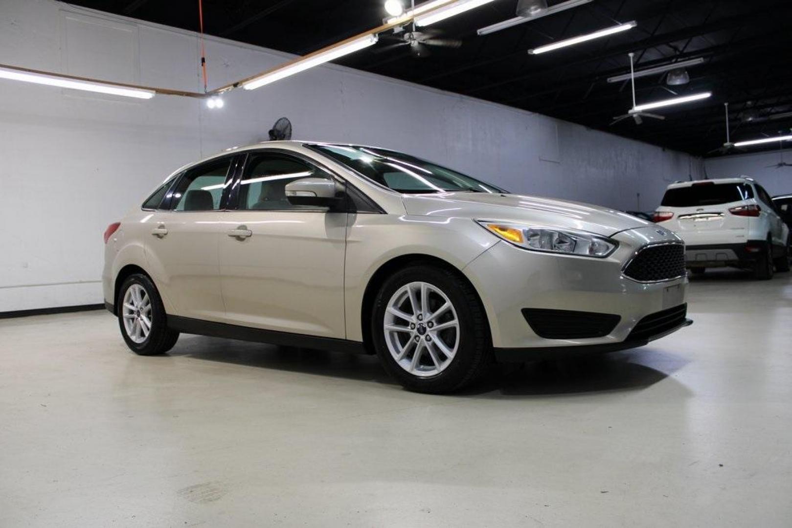 2017 White Gold /Medium Light Stone Ford Focus SE (1FADP3F20HL) with an 2.0L 4-Cylinder DGI Flex Fuel Turbocharged DOHC engine, Automatic transmission, located at 15300 Midway Rd., Addison, TX, 75001, (972) 702-0011, 32.958321, -96.838074 - 2017 Ford Focus SE<br>Now Available at Midway Auto Group Addison, Texas<br><br>Smart, efficient, and comfortable, the 2017 Ford Focus SE is a compact sedan that delivers excellent fuel economy, responsive handling, and modern tech at a budget-friendly price. Whether youre commuting through Addison - Photo#6