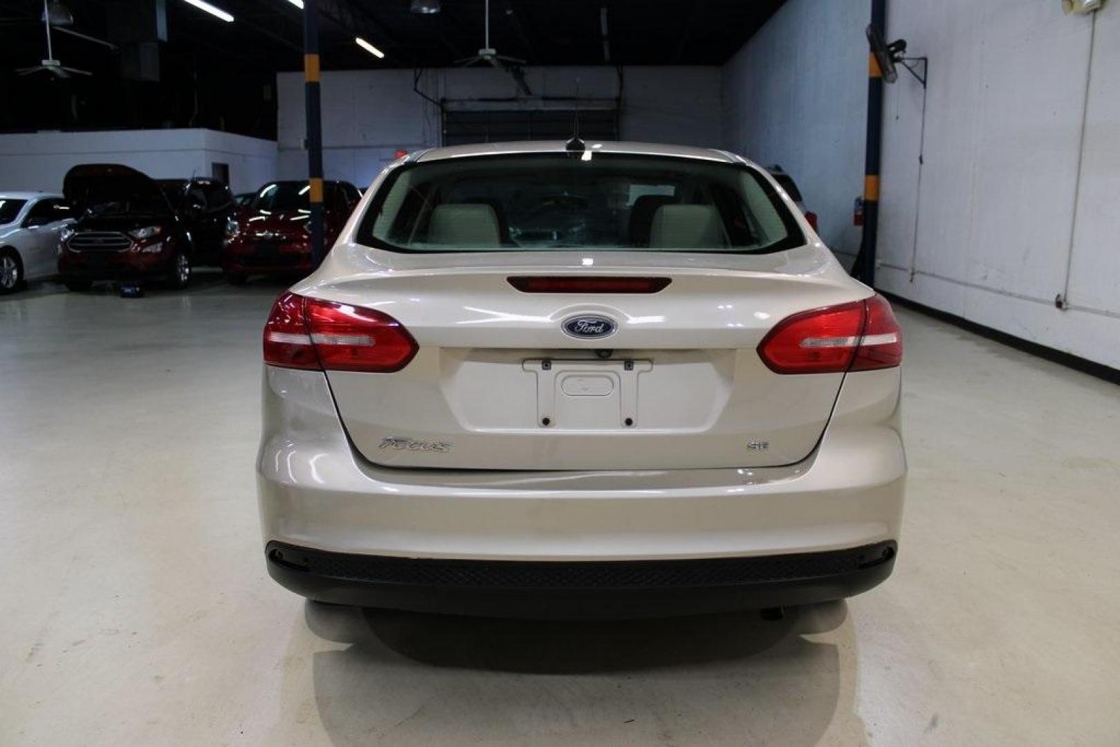 2017 White Gold /Medium Light Stone Ford Focus SE (1FADP3F20HL) with an 2.0L 4-Cylinder DGI Flex Fuel Turbocharged DOHC engine, Automatic transmission, located at 15300 Midway Rd., Addison, TX, 75001, (972) 702-0011, 32.958321, -96.838074 - 2017 Ford Focus SE<br>Now Available at Midway Auto Group Addison, Texas<br><br>Smart, efficient, and comfortable, the 2017 Ford Focus SE is a compact sedan that delivers excellent fuel economy, responsive handling, and modern tech at a budget-friendly price. Whether youre commuting through Addison - Photo#7