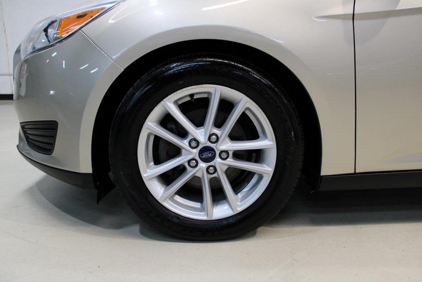 2017 White Gold /Medium Light Stone Ford Focus SE (1FADP3F20HL) with an 2.0L 4-Cylinder DGI Flex Fuel Turbocharged DOHC engine, Automatic transmission, located at 15300 Midway Rd., Addison, TX, 75001, (972) 702-0011, 32.958321, -96.838074 - 2017 Ford Focus SE<br>Now Available at Midway Auto Group Addison, Texas<br><br>Smart, efficient, and comfortable, the 2017 Ford Focus SE is a compact sedan that delivers excellent fuel economy, responsive handling, and modern tech at a budget-friendly price. Whether youre commuting through Addison - Photo#8