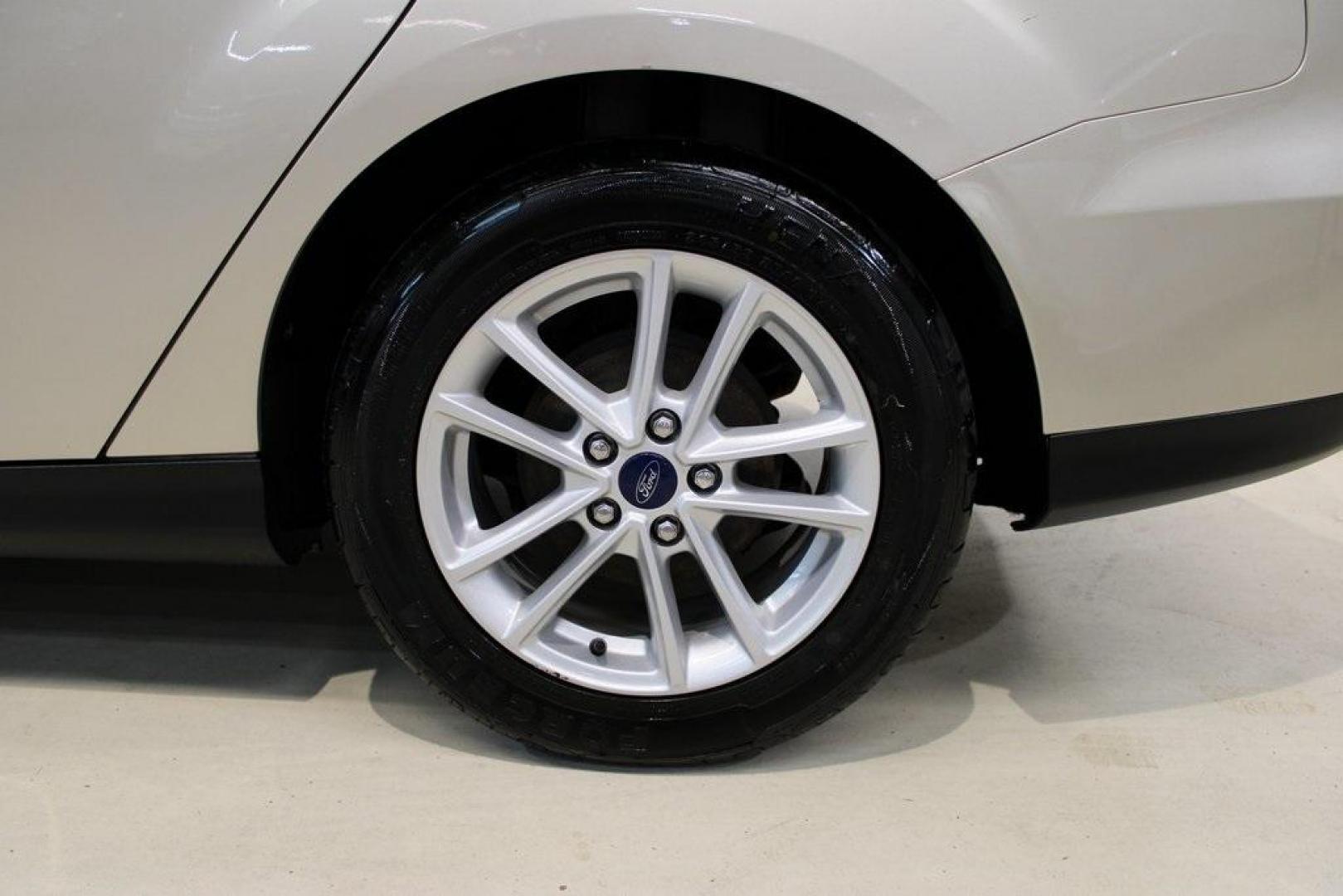 2017 White Gold /Medium Light Stone Ford Focus SE (1FADP3F20HL) with an 2.0L 4-Cylinder DGI Flex Fuel Turbocharged DOHC engine, Automatic transmission, located at 15300 Midway Rd., Addison, TX, 75001, (972) 702-0011, 32.958321, -96.838074 - 2017 Ford Focus SE<br>Now Available at Midway Auto Group Addison, Texas<br><br>Smart, efficient, and comfortable, the 2017 Ford Focus SE is a compact sedan that delivers excellent fuel economy, responsive handling, and modern tech at a budget-friendly price. Whether youre commuting through Addison - Photo#9