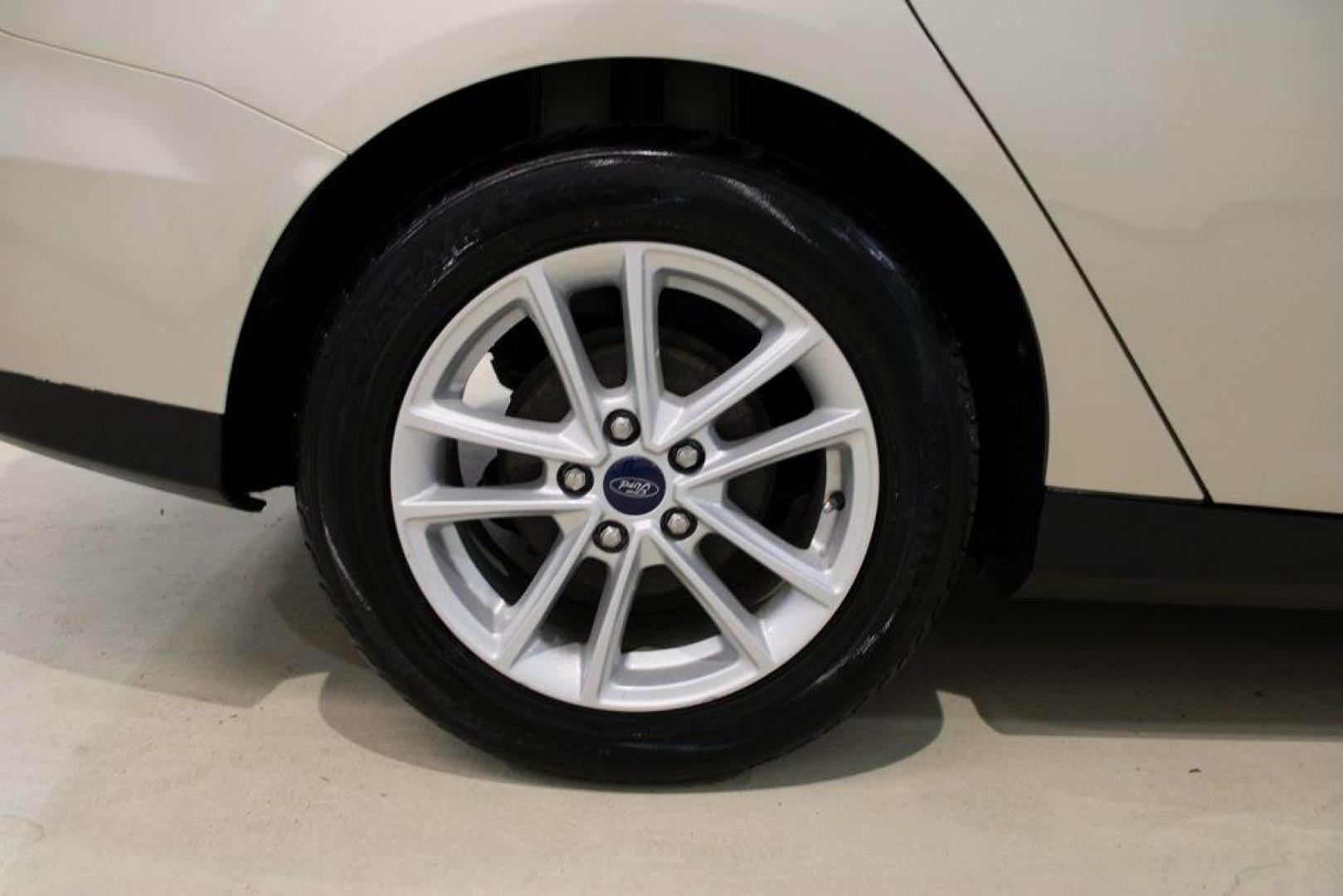 2017 White Gold /Medium Light Stone Ford Focus SE (1FADP3F20HL) with an 2.0L 4-Cylinder DGI Flex Fuel Turbocharged DOHC engine, Automatic transmission, located at 15300 Midway Rd., Addison, TX, 75001, (972) 702-0011, 32.958321, -96.838074 - 2017 Ford Focus SE<br>Now Available at Midway Auto Group Addison, Texas<br><br>Smart, efficient, and comfortable, the 2017 Ford Focus SE is a compact sedan that delivers excellent fuel economy, responsive handling, and modern tech at a budget-friendly price. Whether youre commuting through Addison - Photo#10