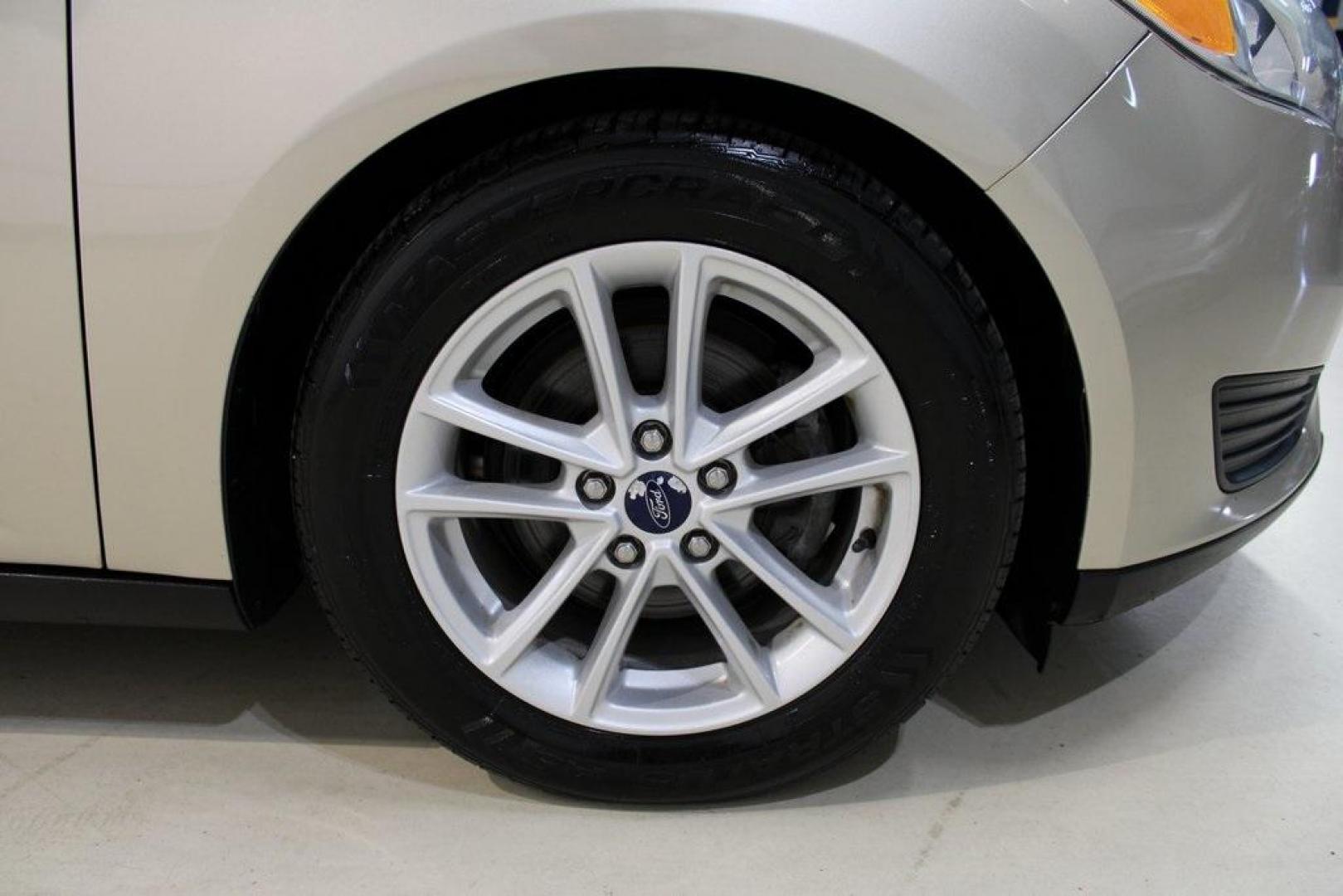 2017 White Gold /Medium Light Stone Ford Focus SE (1FADP3F20HL) with an 2.0L 4-Cylinder DGI Flex Fuel Turbocharged DOHC engine, Automatic transmission, located at 15300 Midway Rd., Addison, TX, 75001, (972) 702-0011, 32.958321, -96.838074 - 2017 Ford Focus SE<br>Now Available at Midway Auto Group Addison, Texas<br><br>Smart, efficient, and comfortable, the 2017 Ford Focus SE is a compact sedan that delivers excellent fuel economy, responsive handling, and modern tech at a budget-friendly price. Whether youre commuting through Addison - Photo#11