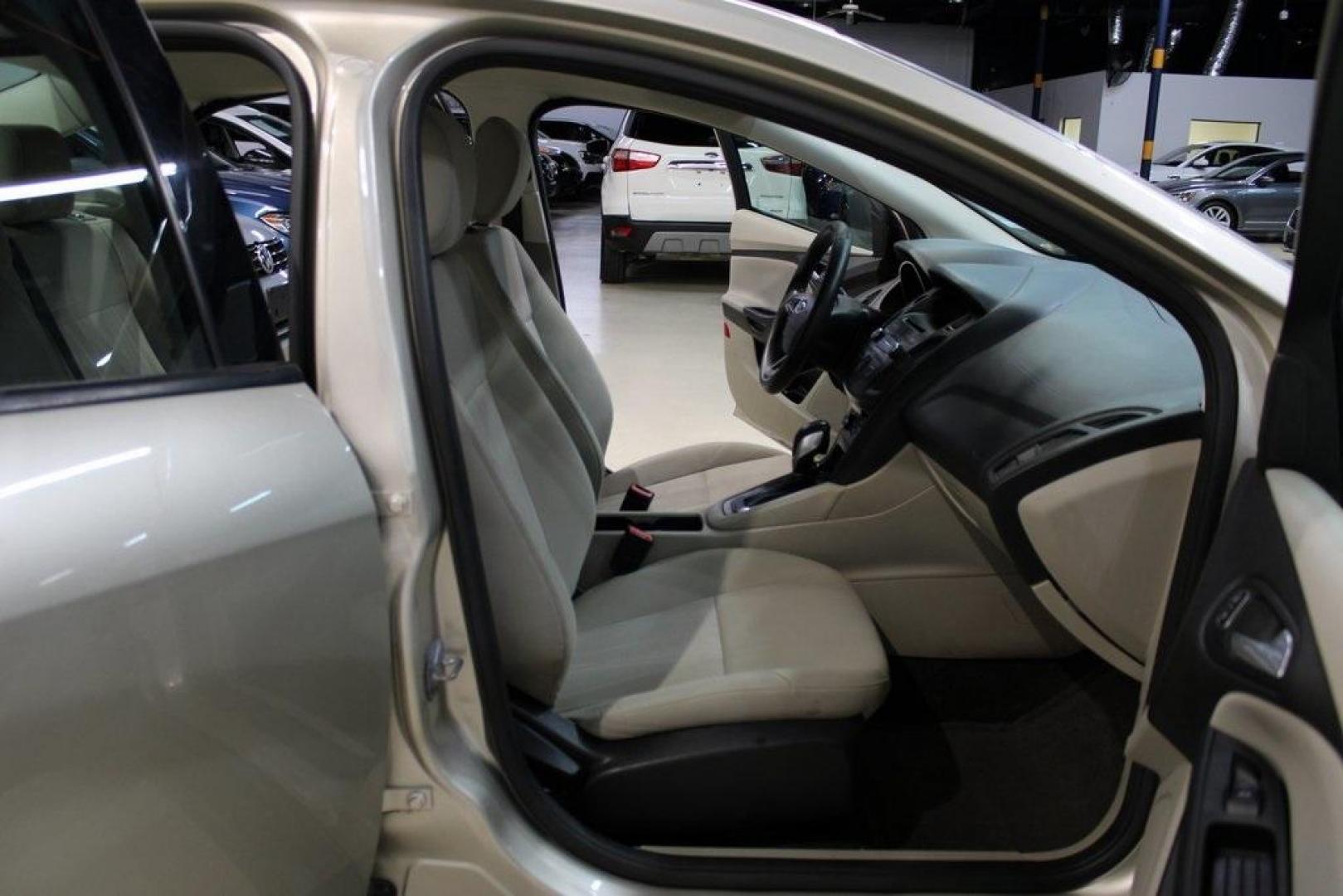 2017 White Gold /Medium Light Stone Ford Focus SE (1FADP3F20HL) with an 2.0L 4-Cylinder DGI Flex Fuel Turbocharged DOHC engine, Automatic transmission, located at 15300 Midway Rd., Addison, TX, 75001, (972) 702-0011, 32.958321, -96.838074 - 2017 Ford Focus SE<br>Now Available at Midway Auto Group Addison, Texas<br><br>Smart, efficient, and comfortable, the 2017 Ford Focus SE is a compact sedan that delivers excellent fuel economy, responsive handling, and modern tech at a budget-friendly price. Whether youre commuting through Addison - Photo#14