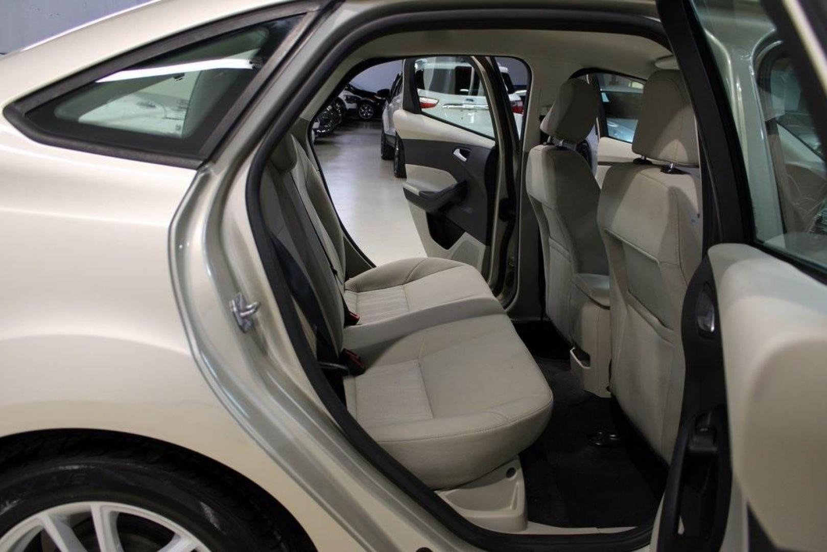 2017 White Gold /Medium Light Stone Ford Focus SE (1FADP3F20HL) with an 2.0L 4-Cylinder DGI Flex Fuel Turbocharged DOHC engine, Automatic transmission, located at 15300 Midway Rd., Addison, TX, 75001, (972) 702-0011, 32.958321, -96.838074 - 2017 Ford Focus SE<br>Now Available at Midway Auto Group Addison, Texas<br><br>Smart, efficient, and comfortable, the 2017 Ford Focus SE is a compact sedan that delivers excellent fuel economy, responsive handling, and modern tech at a budget-friendly price. Whether youre commuting through Addison - Photo#15