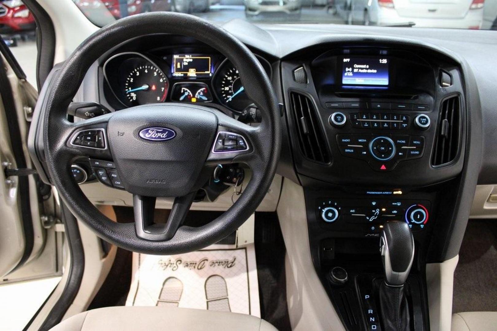 2017 White Gold /Medium Light Stone Ford Focus SE (1FADP3F20HL) with an 2.0L 4-Cylinder DGI Flex Fuel Turbocharged DOHC engine, Automatic transmission, located at 15300 Midway Rd., Addison, TX, 75001, (972) 702-0011, 32.958321, -96.838074 - 2017 Ford Focus SE<br>Now Available at Midway Auto Group Addison, Texas<br><br>Smart, efficient, and comfortable, the 2017 Ford Focus SE is a compact sedan that delivers excellent fuel economy, responsive handling, and modern tech at a budget-friendly price. Whether youre commuting through Addison - Photo#17