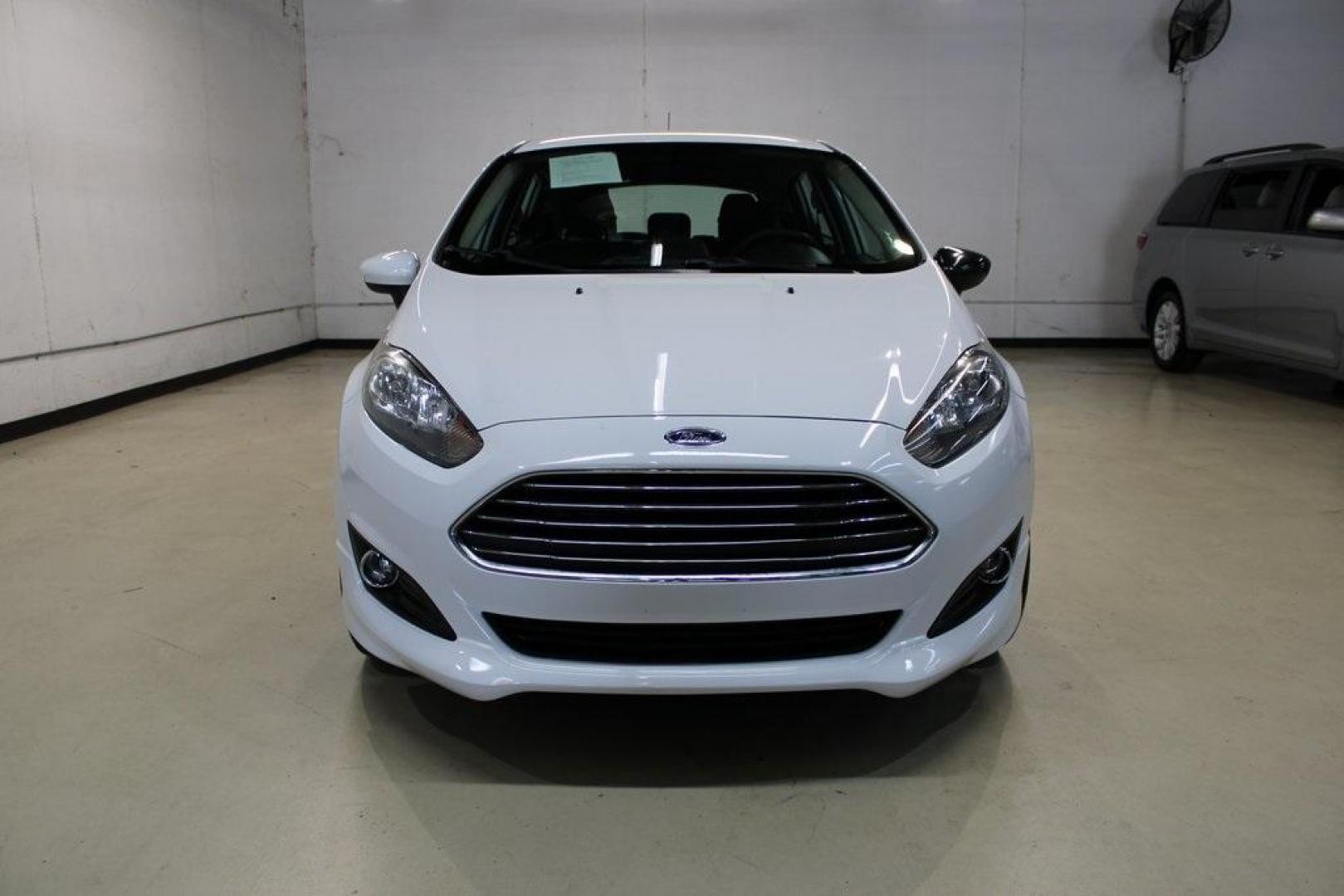 2019 Oxford White /Black Ford Fiesta SE (3FADP4EJ1KM) with an 1.6L I4 Ti-VCT engine, Automatic transmission, located at 15300 Midway Rd., Addison, TX, 75001, (972) 702-0011, 32.958321, -96.838074 - 2019 Ford Fiesta SE Hatchback<br>Now Available at Midway Auto Group Addison, Texas<br><br>Sporty, efficient, and fun to drive, the 2019 Ford Fiesta SE Hatchback delivers big versatility in a compact package. With its hatchback design, nimble handling, and great fuel economy, this Fiesta is perfect - Photo#5