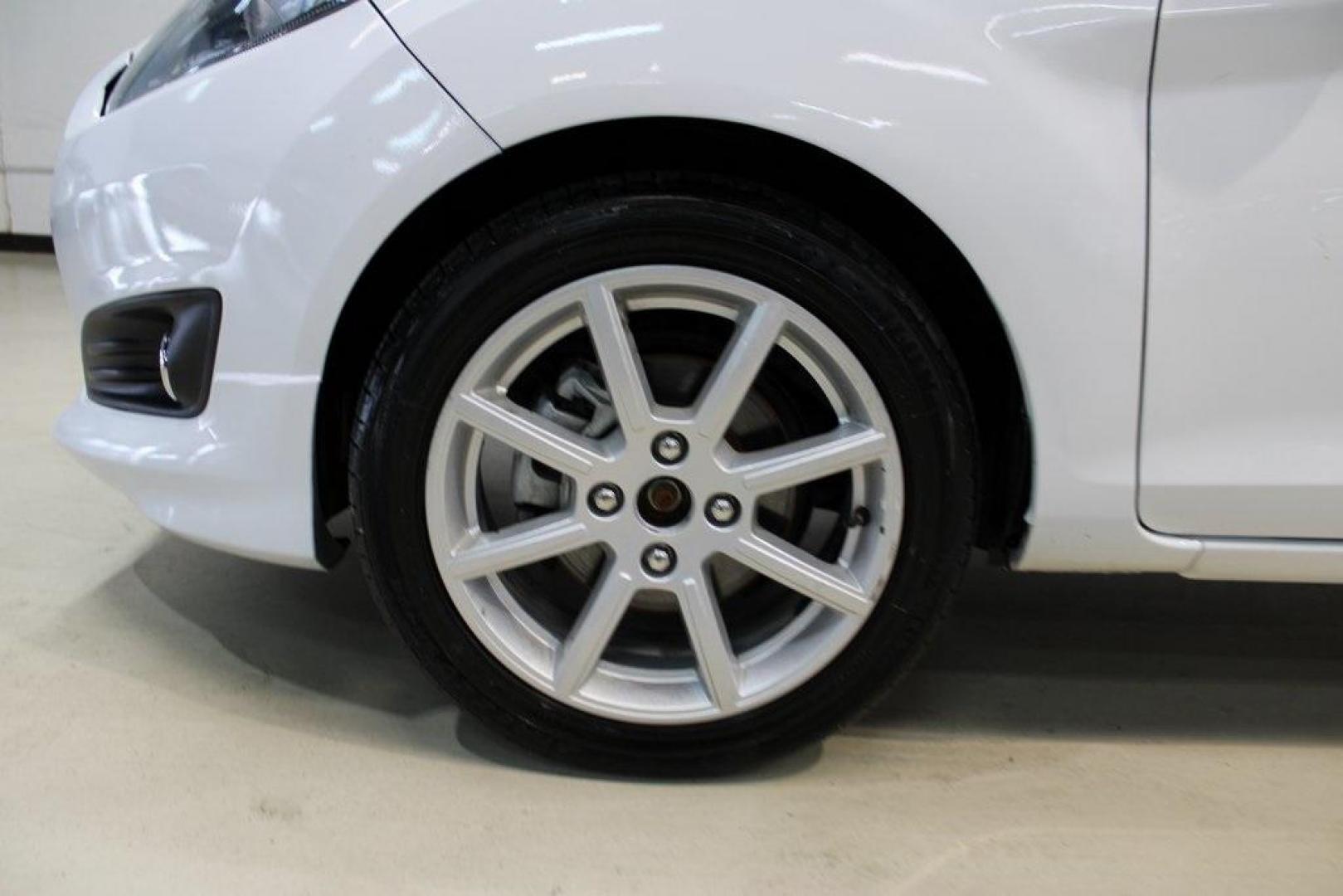 2019 Oxford White /Black Ford Fiesta SE (3FADP4EJ1KM) with an 1.6L I4 Ti-VCT engine, Automatic transmission, located at 15300 Midway Rd., Addison, TX, 75001, (972) 702-0011, 32.958321, -96.838074 - 2019 Ford Fiesta SE Hatchback<br>Now Available at Midway Auto Group Addison, Texas<br><br>Sporty, efficient, and fun to drive, the 2019 Ford Fiesta SE Hatchback delivers big versatility in a compact package. With its hatchback design, nimble handling, and great fuel economy, this Fiesta is perfect - Photo#8