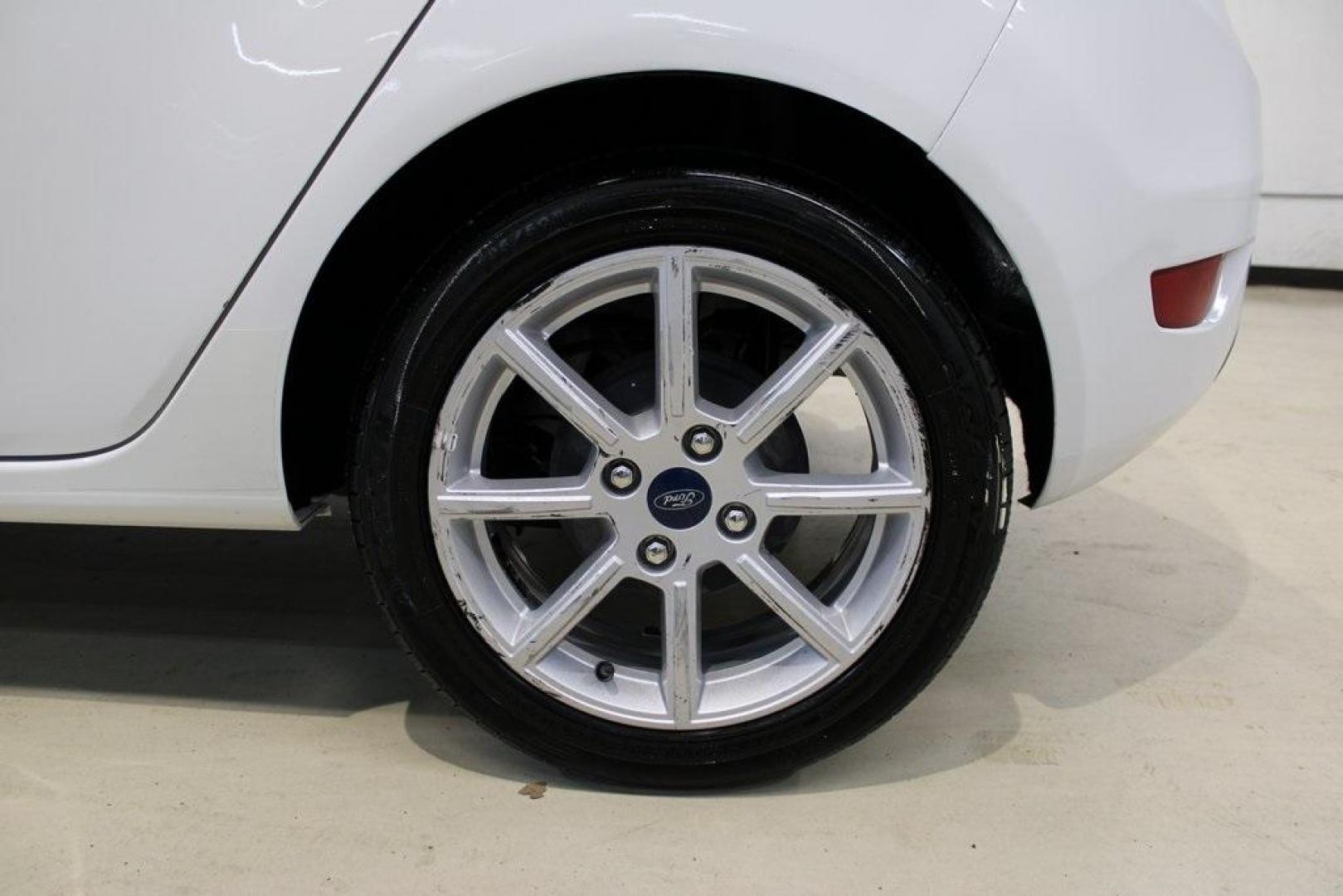 2019 Oxford White /Black Ford Fiesta SE (3FADP4EJ1KM) with an 1.6L I4 Ti-VCT engine, Automatic transmission, located at 15300 Midway Rd., Addison, TX, 75001, (972) 702-0011, 32.958321, -96.838074 - 2019 Ford Fiesta SE Hatchback<br>Now Available at Midway Auto Group Addison, Texas<br><br>Sporty, efficient, and fun to drive, the 2019 Ford Fiesta SE Hatchback delivers big versatility in a compact package. With its hatchback design, nimble handling, and great fuel economy, this Fiesta is perfect - Photo#9