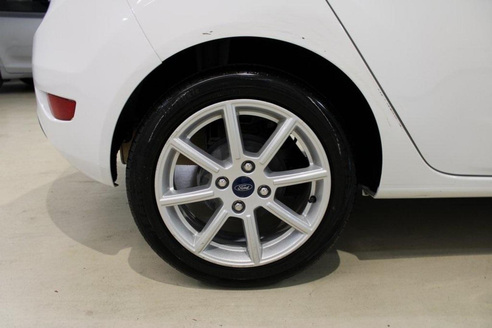 2019 Oxford White /Black Ford Fiesta SE (3FADP4EJ1KM) with an 1.6L I4 Ti-VCT engine, Automatic transmission, located at 15300 Midway Rd., Addison, TX, 75001, (972) 702-0011, 32.958321, -96.838074 - 2019 Ford Fiesta SE Hatchback<br>Now Available at Midway Auto Group Addison, Texas<br><br>Sporty, efficient, and fun to drive, the 2019 Ford Fiesta SE Hatchback delivers big versatility in a compact package. With its hatchback design, nimble handling, and great fuel economy, this Fiesta is perfect - Photo#10