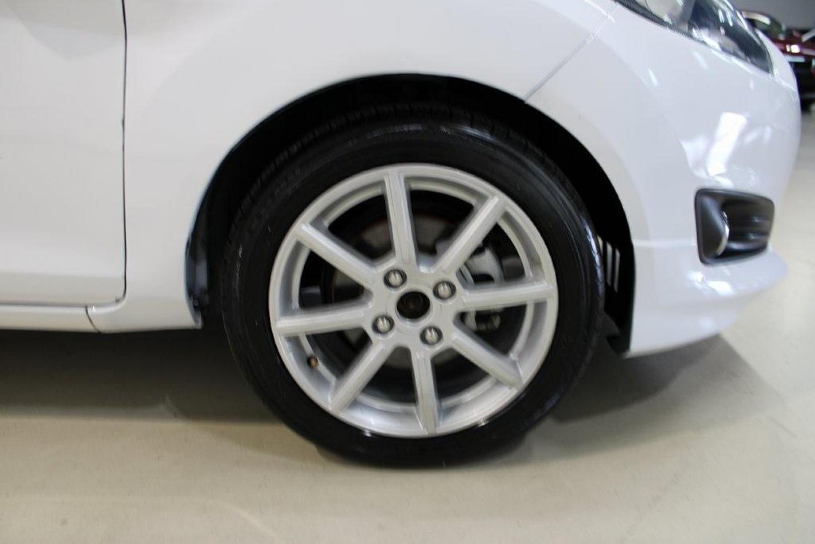 2019 Oxford White /Black Ford Fiesta SE (3FADP4EJ1KM) with an 1.6L I4 Ti-VCT engine, Automatic transmission, located at 15300 Midway Rd., Addison, TX, 75001, (972) 702-0011, 32.958321, -96.838074 - 2019 Ford Fiesta SE Hatchback<br>Now Available at Midway Auto Group Addison, Texas<br><br>Sporty, efficient, and fun to drive, the 2019 Ford Fiesta SE Hatchback delivers big versatility in a compact package. With its hatchback design, nimble handling, and great fuel economy, this Fiesta is perfect - Photo#11