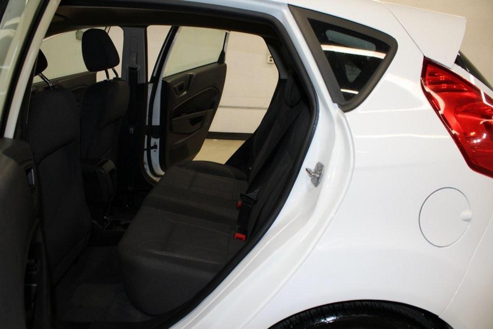 2019 Oxford White /Black Ford Fiesta SE (3FADP4EJ1KM) with an 1.6L I4 Ti-VCT engine, Automatic transmission, located at 15300 Midway Rd., Addison, TX, 75001, (972) 702-0011, 32.958321, -96.838074 - 2019 Ford Fiesta SE Hatchback<br>Now Available at Midway Auto Group Addison, Texas<br><br>Sporty, efficient, and fun to drive, the 2019 Ford Fiesta SE Hatchback delivers big versatility in a compact package. With its hatchback design, nimble handling, and great fuel economy, this Fiesta is perfect - Photo#14