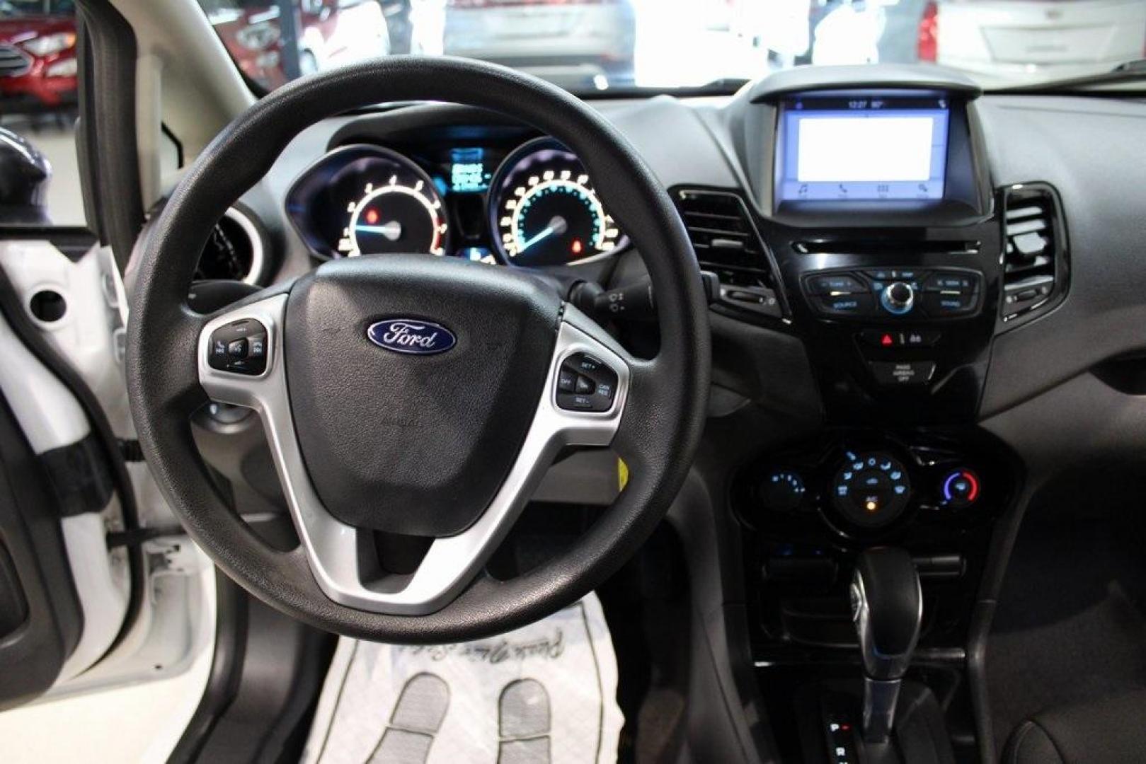 2019 Oxford White /Black Ford Fiesta SE (3FADP4EJ1KM) with an 1.6L I4 Ti-VCT engine, Automatic transmission, located at 15300 Midway Rd., Addison, TX, 75001, (972) 702-0011, 32.958321, -96.838074 - 2019 Ford Fiesta SE Hatchback<br>Now Available at Midway Auto Group Addison, Texas<br><br>Sporty, efficient, and fun to drive, the 2019 Ford Fiesta SE Hatchback delivers big versatility in a compact package. With its hatchback design, nimble handling, and great fuel economy, this Fiesta is perfect - Photo#15