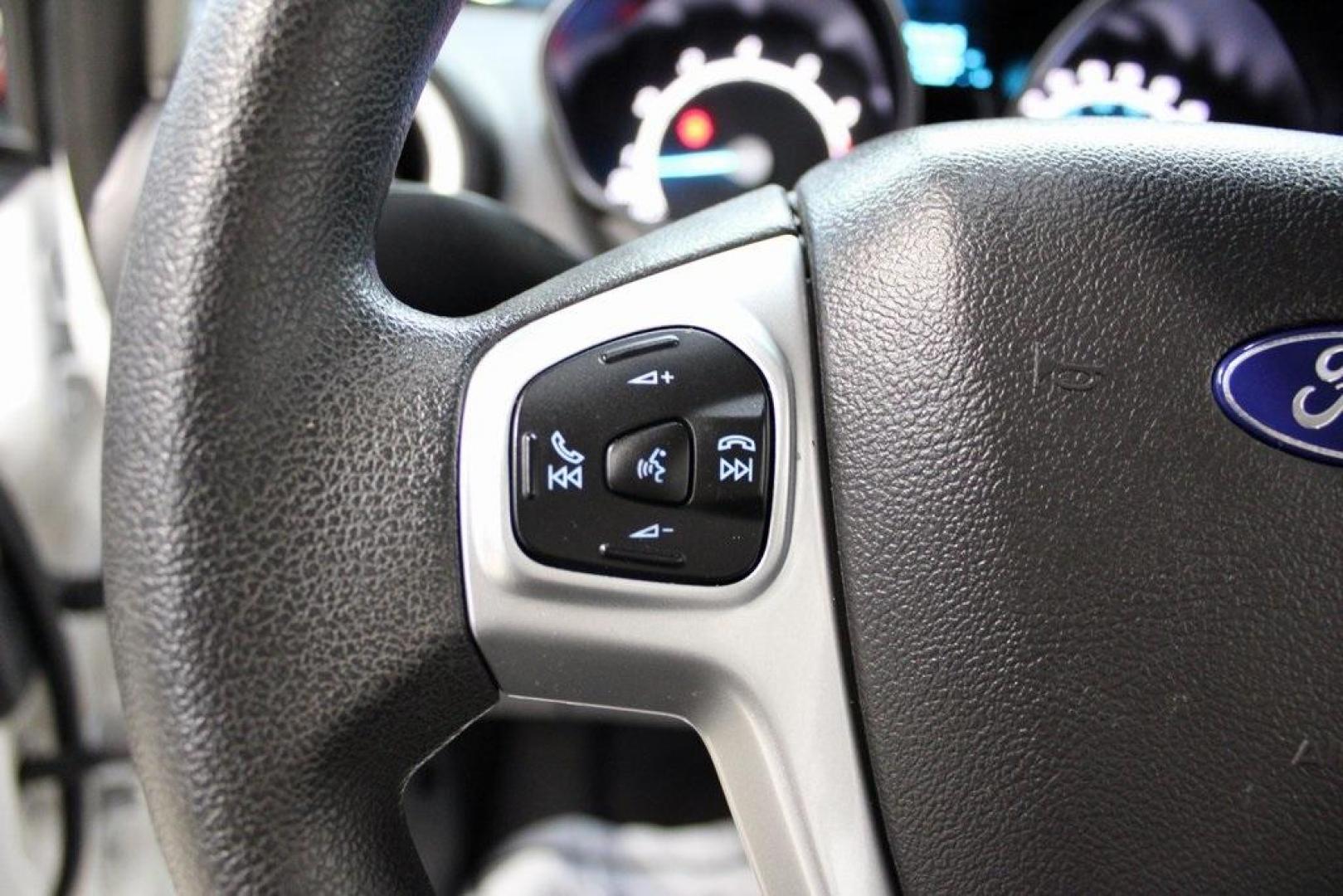 2019 Oxford White /Black Ford Fiesta SE (3FADP4EJ1KM) with an 1.6L I4 Ti-VCT engine, Automatic transmission, located at 15300 Midway Rd., Addison, TX, 75001, (972) 702-0011, 32.958321, -96.838074 - 2019 Ford Fiesta SE Hatchback<br>Now Available at Midway Auto Group Addison, Texas<br><br>Sporty, efficient, and fun to drive, the 2019 Ford Fiesta SE Hatchback delivers big versatility in a compact package. With its hatchback design, nimble handling, and great fuel economy, this Fiesta is perfect - Photo#21