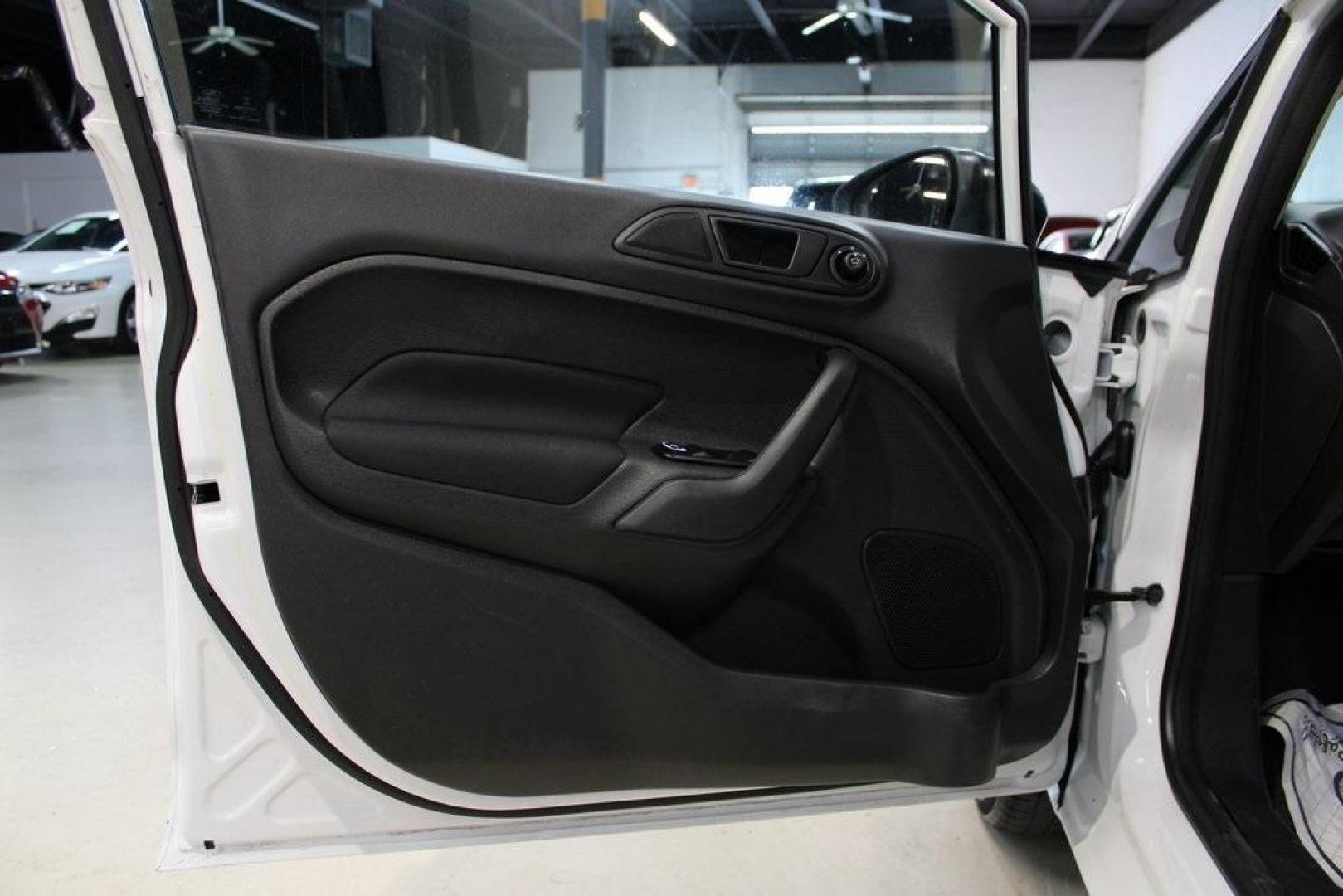 2019 Oxford White /Black Ford Fiesta SE (3FADP4EJ1KM) with an 1.6L I4 Ti-VCT engine, Automatic transmission, located at 15300 Midway Rd., Addison, TX, 75001, (972) 702-0011, 32.958321, -96.838074 - 2019 Ford Fiesta SE Hatchback<br>Now Available at Midway Auto Group Addison, Texas<br><br>Sporty, efficient, and fun to drive, the 2019 Ford Fiesta SE Hatchback delivers big versatility in a compact package. With its hatchback design, nimble handling, and great fuel economy, this Fiesta is perfect - Photo#22