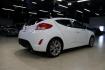 2016 White /Black Hyundai Veloster Base (KMHTC6AD8GU) with an 1.6L I4 DGI DOHC 16V ULEV II 132hp engine, Automatic transmission, located at 15300 Midway Rd., Addison, TX, 75001, (972) 702-0011, 32.958321, -96.838074 - 2016 Hyundai Veloster<br>Now Available at Midway Auto Group Addison, Texas<br><br>Sporty, unique, and fun to drive, the 2016 Hyundai Veloster stands out with its bold design and hatchback versatility. Perfect for drivers who want style, efficiency, and modern tech in one compact package, the Velost - Photo#2