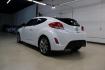 2016 White /Black Hyundai Veloster Base (KMHTC6AD8GU) with an 1.6L I4 DGI DOHC 16V ULEV II 132hp engine, Automatic transmission, located at 15300 Midway Rd., Addison, TX, 75001, (972) 702-0011, 32.958321, -96.838074 - 2016 Hyundai Veloster<br>Now Available at Midway Auto Group Addison, Texas<br><br>Sporty, unique, and fun to drive, the 2016 Hyundai Veloster stands out with its bold design and hatchback versatility. Perfect for drivers who want style, efficiency, and modern tech in one compact package, the Velost - Photo#3