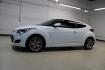 2016 White /Black Hyundai Veloster Base (KMHTC6AD8GU) with an 1.6L I4 DGI DOHC 16V ULEV II 132hp engine, Automatic transmission, located at 15300 Midway Rd., Addison, TX, 75001, (972) 702-0011, 32.958321, -96.838074 - 2016 Hyundai Veloster<br>Now Available at Midway Auto Group Addison, Texas<br><br>Sporty, unique, and fun to drive, the 2016 Hyundai Veloster stands out with its bold design and hatchback versatility. Perfect for drivers who want style, efficiency, and modern tech in one compact package, the Velost - Photo#4