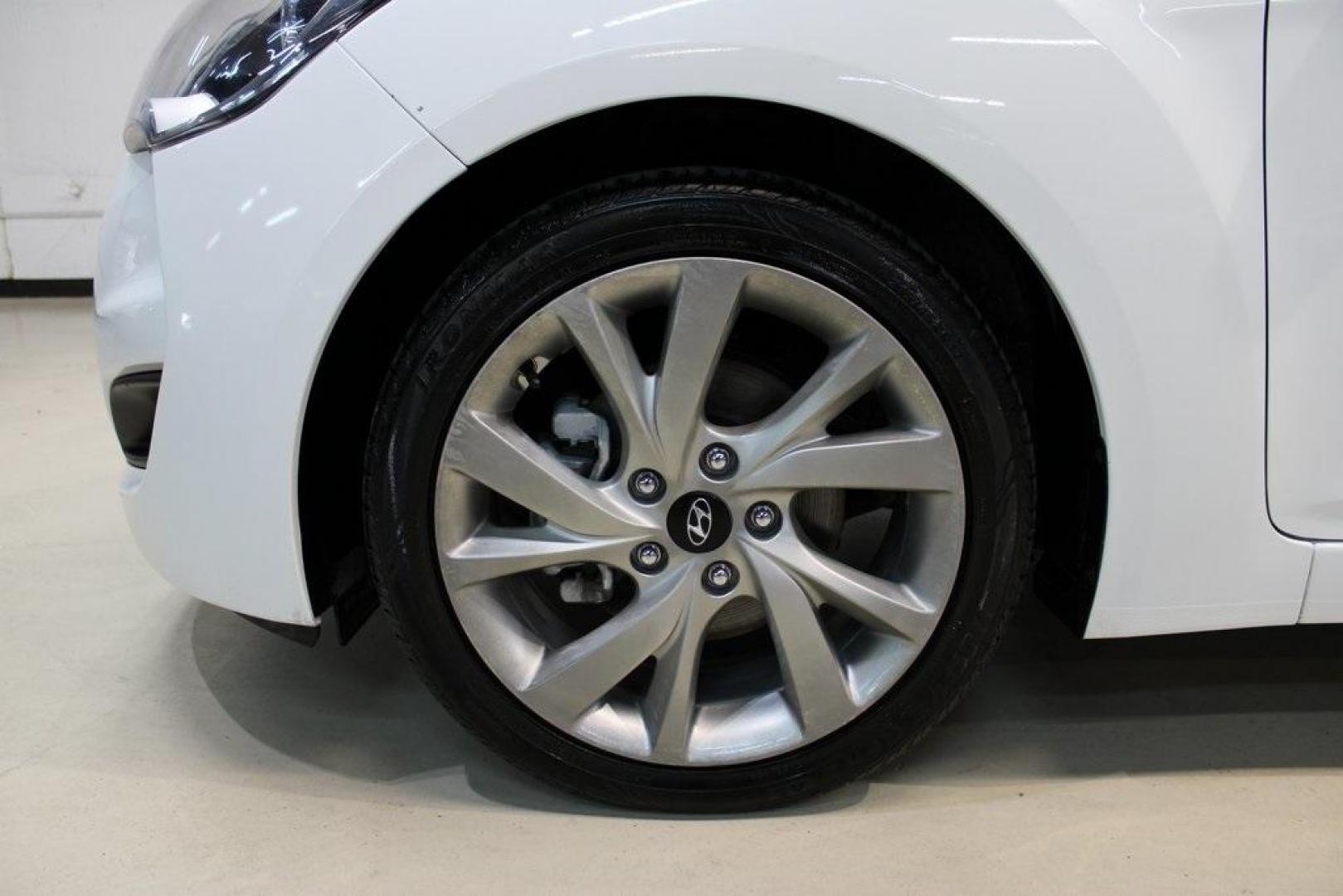 2016 White /Black Hyundai Veloster Base (KMHTC6AD8GU) with an 1.6L I4 DGI DOHC 16V ULEV II 132hp engine, Automatic transmission, located at 15300 Midway Rd., Addison, TX, 75001, (972) 702-0011, 32.958321, -96.838074 - 2016 Hyundai Veloster<br>Now Available at Midway Auto Group Addison, Texas<br><br>Sporty, unique, and fun to drive, the 2016 Hyundai Veloster stands out with its bold design and hatchback versatility. Perfect for drivers who want style, efficiency, and modern tech in one compact package, the Velost - Photo#8