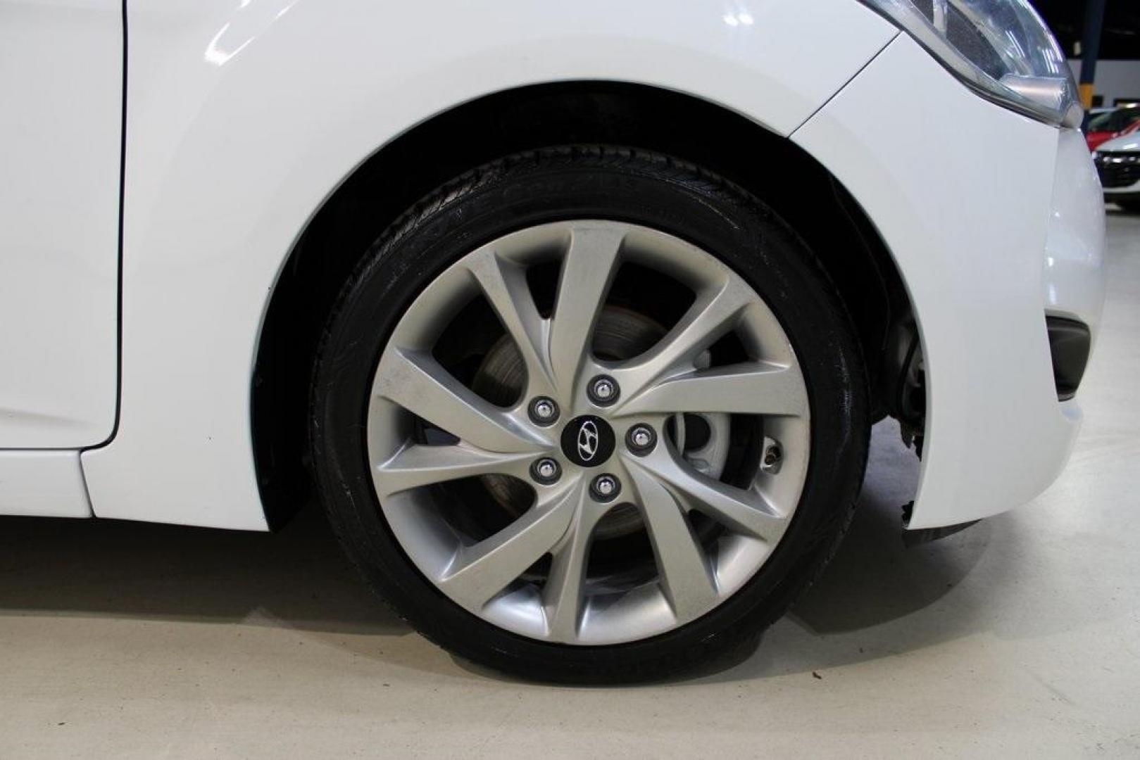 2016 White /Black Hyundai Veloster Base (KMHTC6AD8GU) with an 1.6L I4 DGI DOHC 16V ULEV II 132hp engine, Automatic transmission, located at 15300 Midway Rd., Addison, TX, 75001, (972) 702-0011, 32.958321, -96.838074 - 2016 Hyundai Veloster<br>Now Available at Midway Auto Group Addison, Texas<br><br>Sporty, unique, and fun to drive, the 2016 Hyundai Veloster stands out with its bold design and hatchback versatility. Perfect for drivers who want style, efficiency, and modern tech in one compact package, the Velost - Photo#11