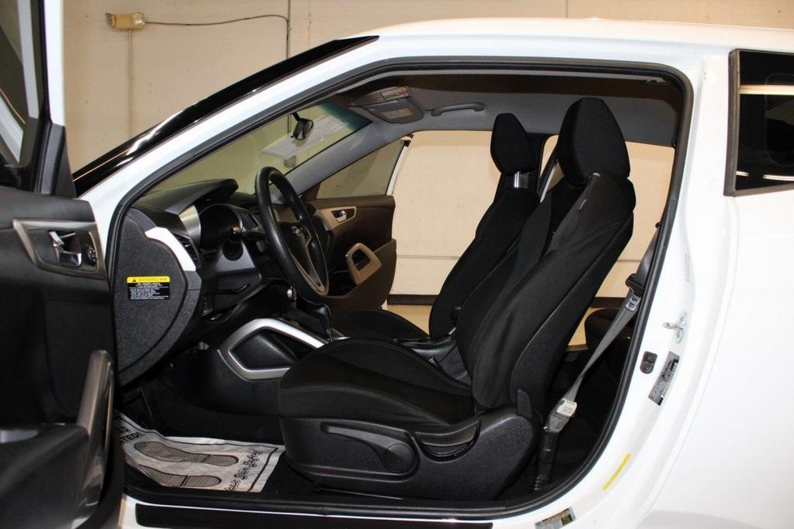 2016 White /Black Hyundai Veloster Base (KMHTC6AD8GU) with an 1.6L I4 DGI DOHC 16V ULEV II 132hp engine, Automatic transmission, located at 15300 Midway Rd., Addison, TX, 75001, (972) 702-0011, 32.958321, -96.838074 - 2016 Hyundai Veloster<br>Now Available at Midway Auto Group Addison, Texas<br><br>Sporty, unique, and fun to drive, the 2016 Hyundai Veloster stands out with its bold design and hatchback versatility. Perfect for drivers who want style, efficiency, and modern tech in one compact package, the Velost - Photo#13