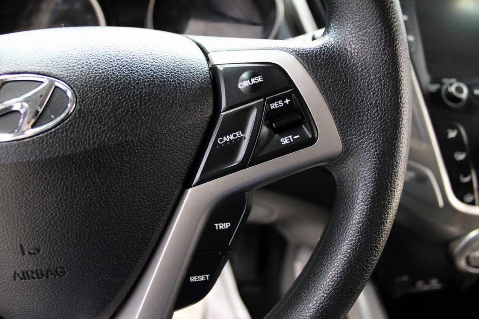 2016 White /Black Hyundai Veloster Base (KMHTC6AD8GU) with an 1.6L I4 DGI DOHC 16V ULEV II 132hp engine, Automatic transmission, located at 15300 Midway Rd., Addison, TX, 75001, (972) 702-0011, 32.958321, -96.838074 - 2016 Hyundai Veloster<br>Now Available at Midway Auto Group Addison, Texas<br><br>Sporty, unique, and fun to drive, the 2016 Hyundai Veloster stands out with its bold design and hatchback versatility. Perfect for drivers who want style, efficiency, and modern tech in one compact package, the Velost - Photo#21