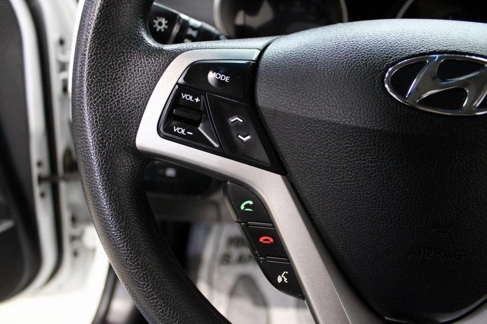 2016 White /Black Hyundai Veloster Base (KMHTC6AD8GU) with an 1.6L I4 DGI DOHC 16V ULEV II 132hp engine, Automatic transmission, located at 15300 Midway Rd., Addison, TX, 75001, (972) 702-0011, 32.958321, -96.838074 - 2016 Hyundai Veloster<br>Now Available at Midway Auto Group Addison, Texas<br><br>Sporty, unique, and fun to drive, the 2016 Hyundai Veloster stands out with its bold design and hatchback versatility. Perfect for drivers who want style, efficiency, and modern tech in one compact package, the Velost - Photo#22
