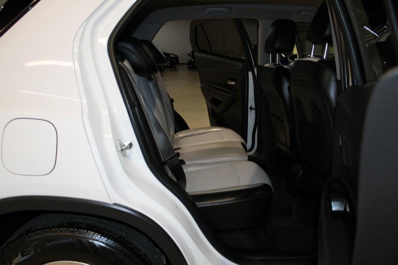 2020 Summit White /Jet Black/Light Ash Gray Chevrolet Trax LT (3GNCJLSB9LL) with an ECOTEC 1.4L I4 SMPI DOHC Turbocharged VVT engine, Automatic transmission, located at 15300 Midway Rd., Addison, TX, 75001, (972) 702-0011, 32.958321, -96.838074 - 2020 Chevrolet Trax LT<br>Now Available at Midway Auto Group Addison, Texas<br><br>The 2020 Chevrolet Trax LT is a compact SUV that punches above its weight with smart design, excellent maneuverability, and modern tech features. Whether you're zipping through Addison traffic or planning a weekend e - Photo#14